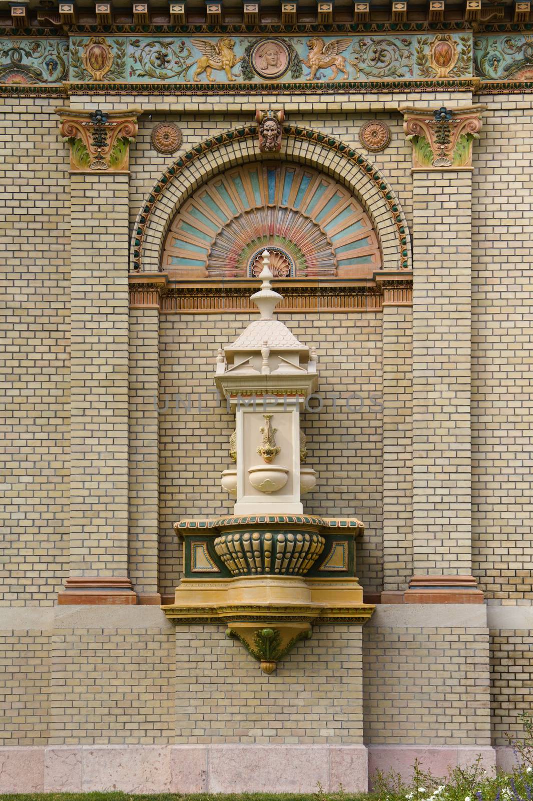 A historic fountain in a historic house wall decoration.