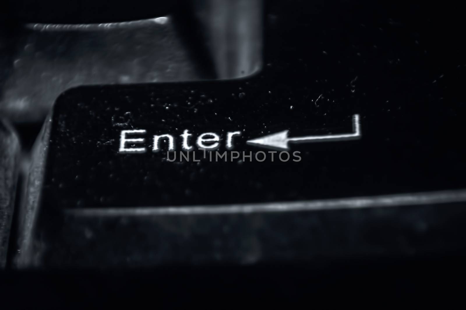 Macro shot of enter key on keyboard. by mirzamlk