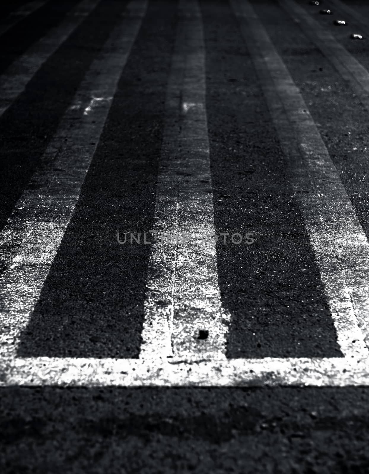 Extreme close up shot of cross walks or zebra crossing on roads.