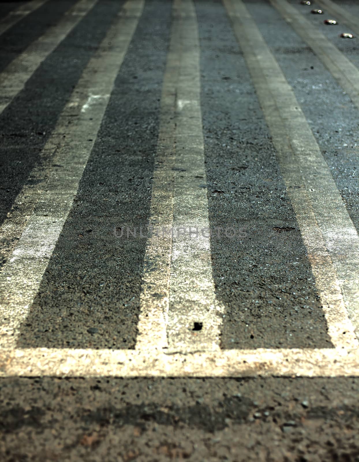 Extreme close up shot of cross walks or zebra crossing on roads.