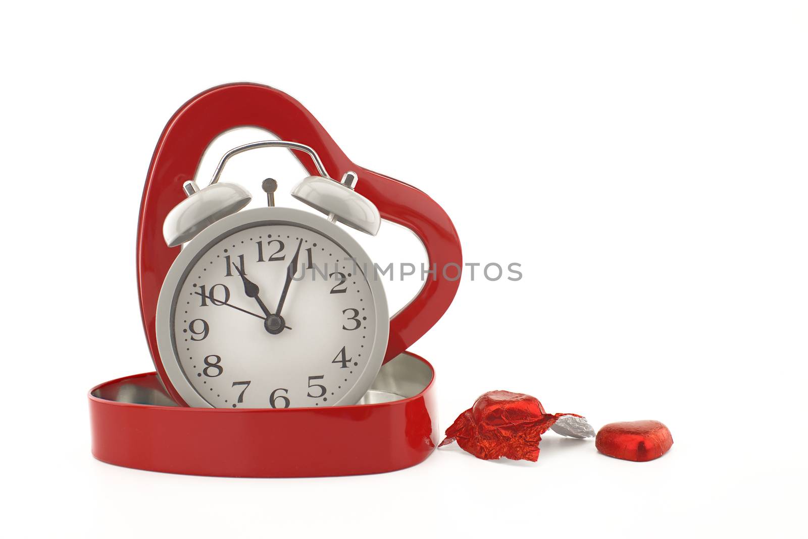 Retro alarm clock in a red heart shaped box by NetPix