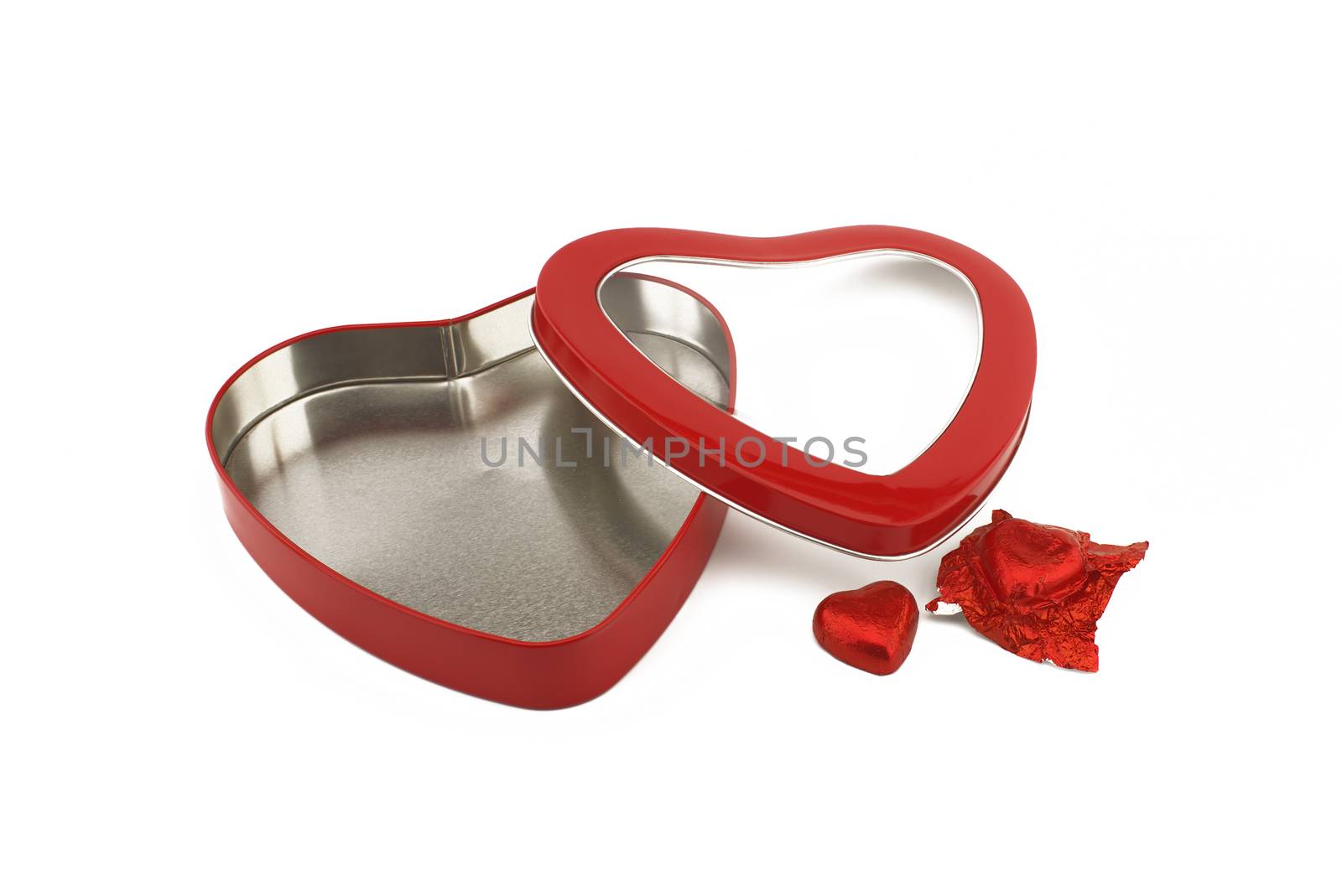 Red heart shaped box with chocolate candy by NetPix