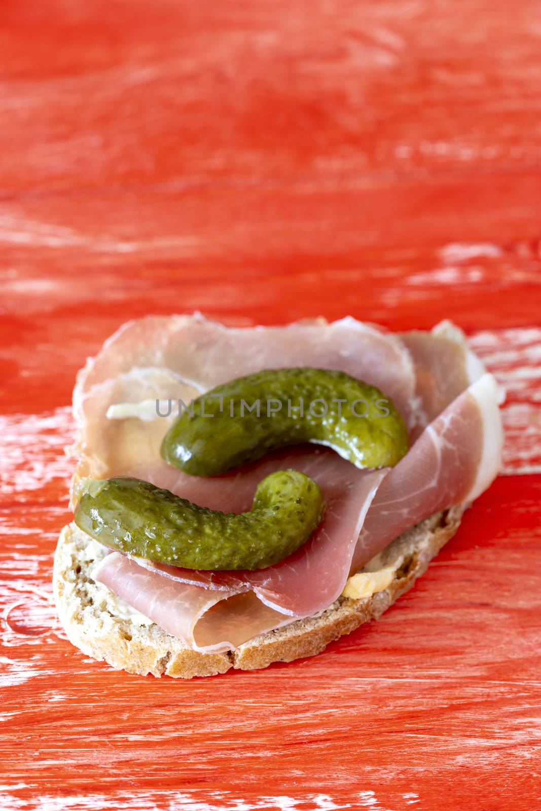 ham sandwich on red background