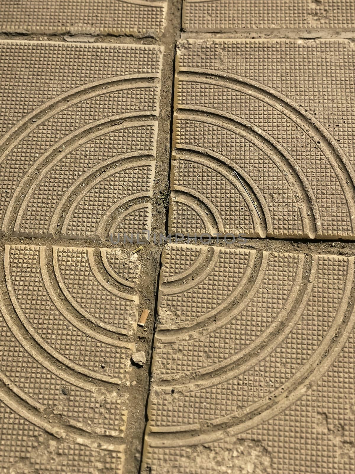 Cracked  path tile. Damaged sidewalk floor surface. Scratched and smashed aged flooring structure. Destroyed grunge square block of pathway. Photography of tiled walkway after earthquake or cataclysm.