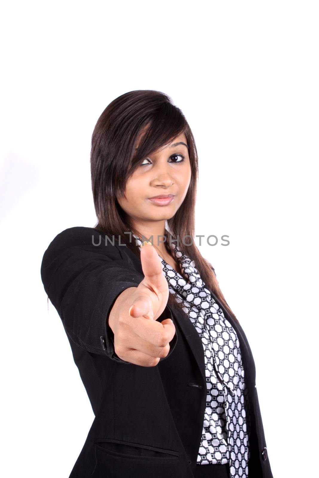 A metaphorical image of a young Indian businesswoman choosing an employee by pointing at the camera, on white studio background.