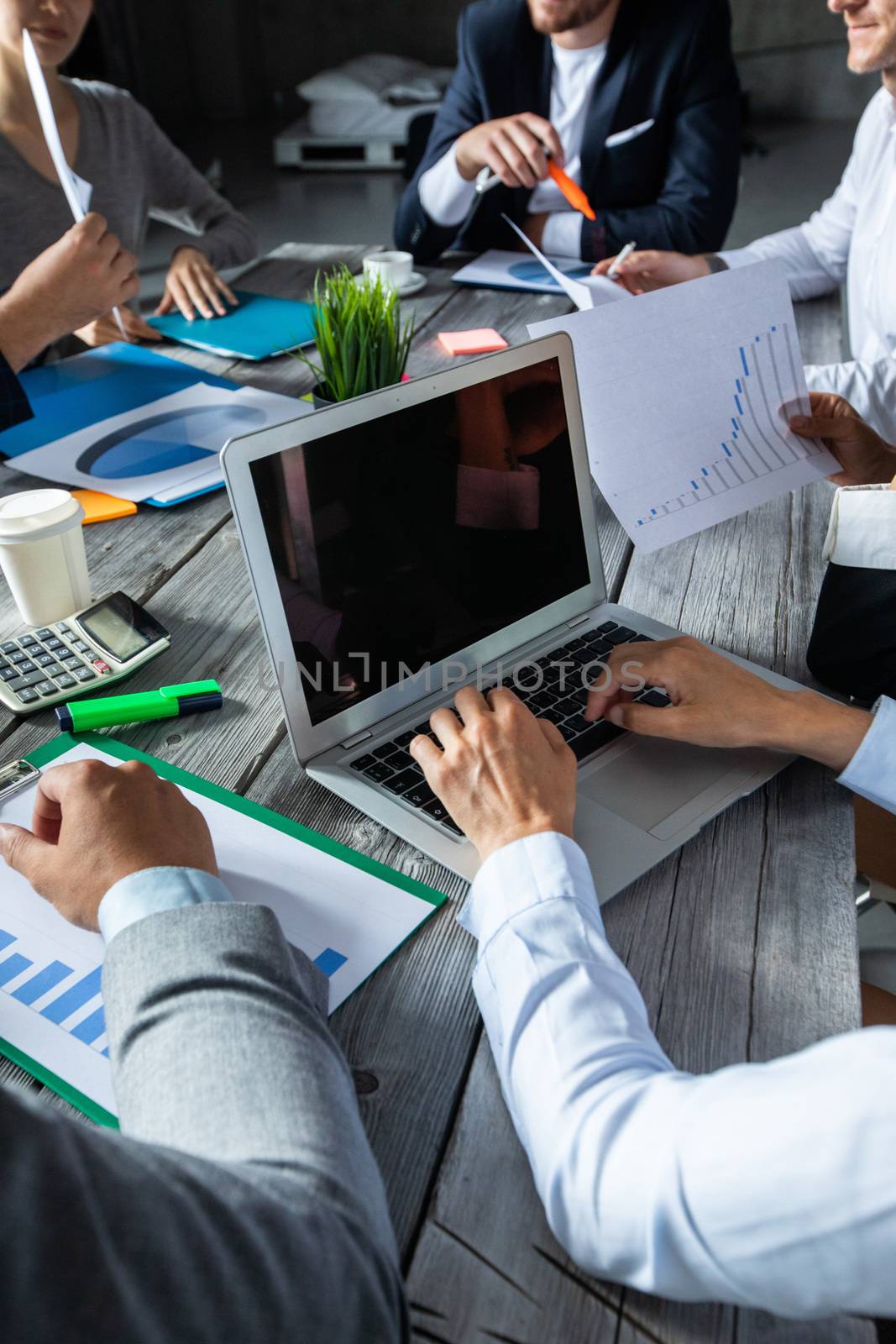 Business corporate management planning team concept, people sitting around office table and working with financial data reports