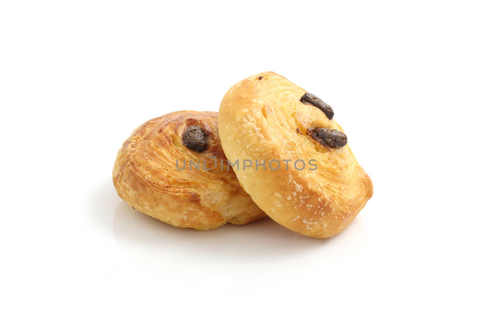 raisin rolls cake isolated on a white background  by piyato