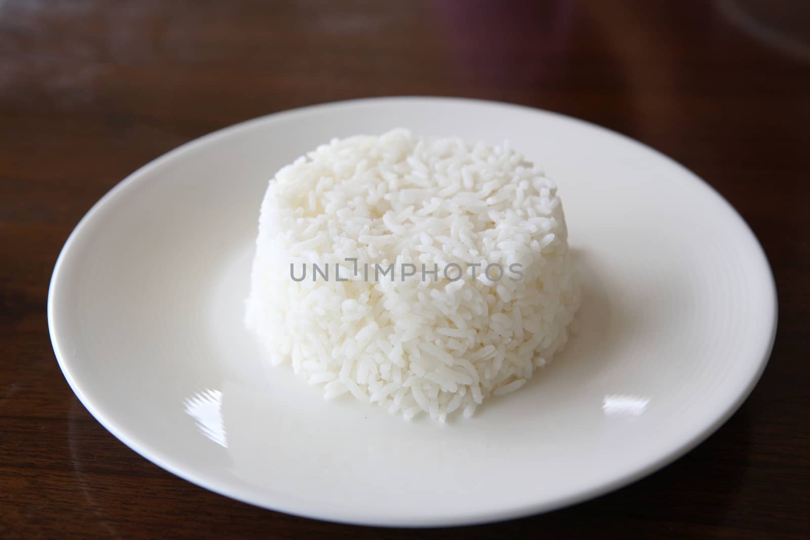 Rice with wood background by piyato