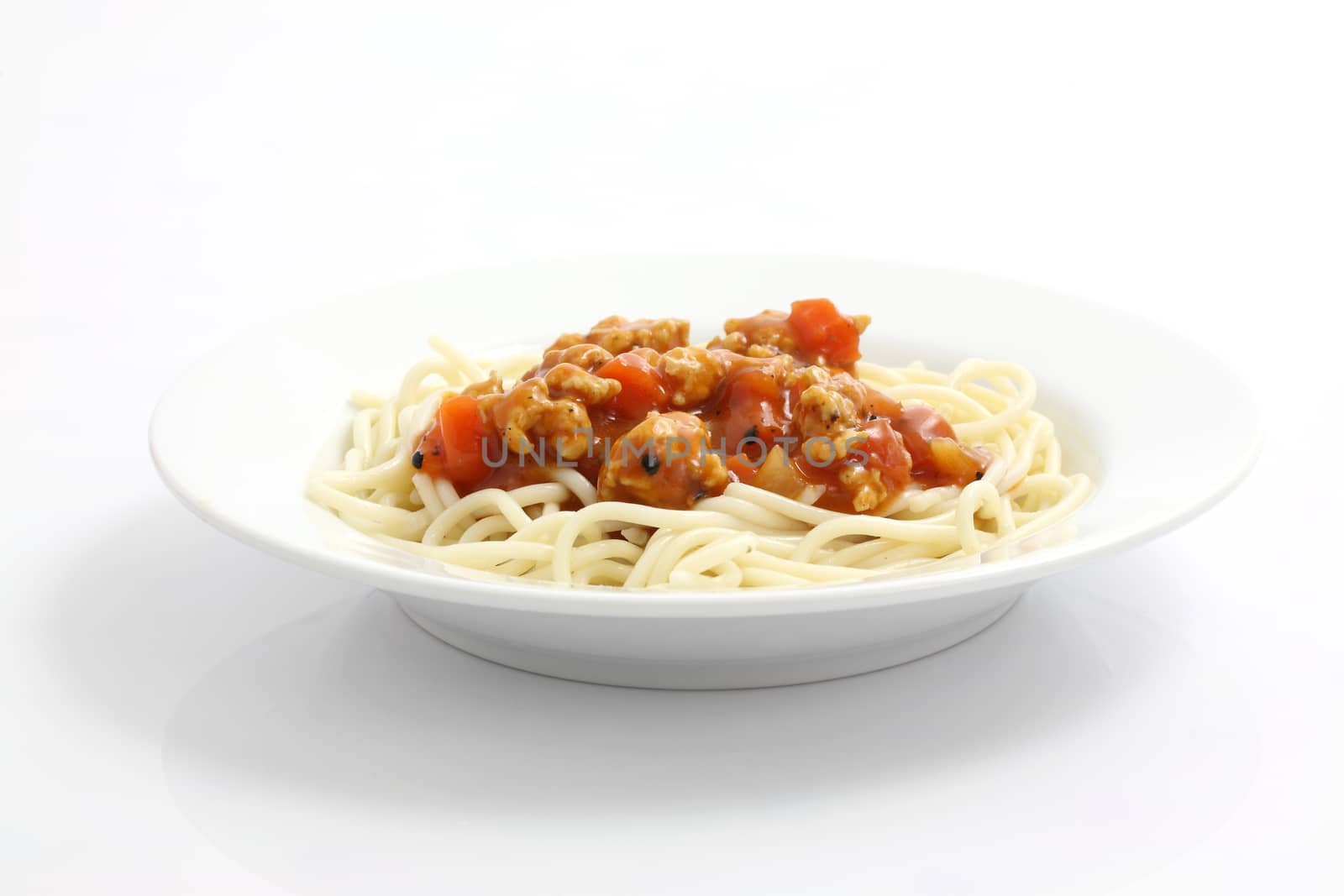 spaghetti with tomato sauce isolated in white background by piyato