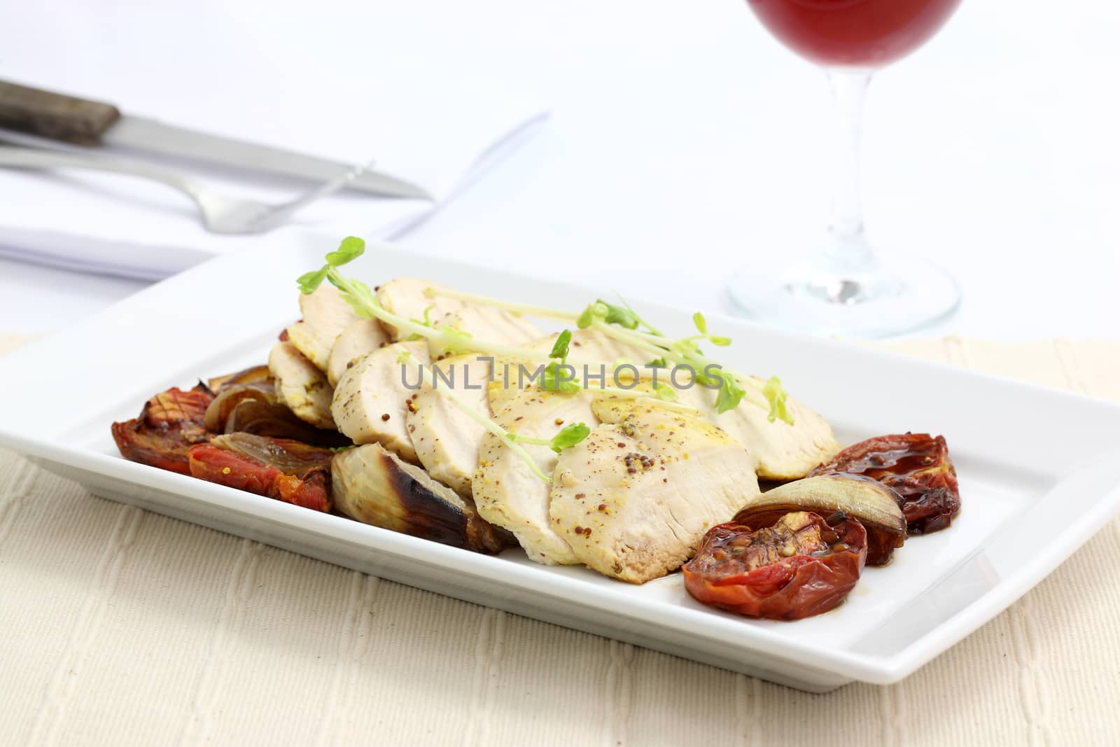 Chicken salad with wine in white background by piyato