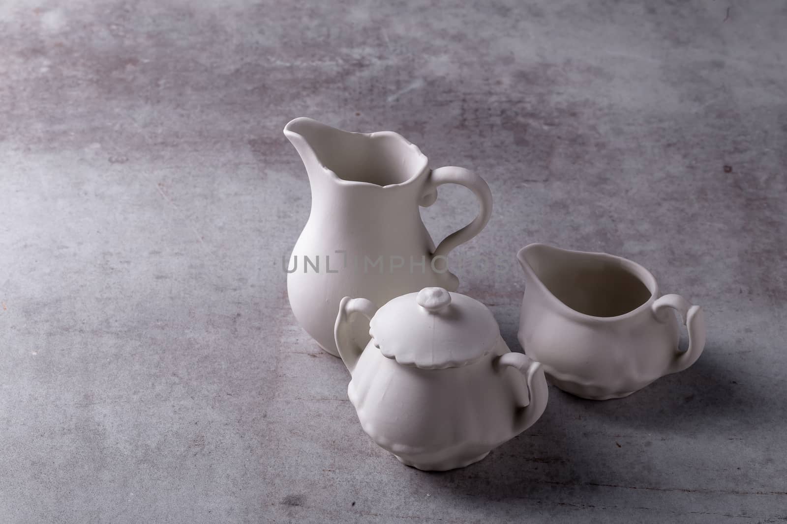 Teapot creamer, Cup and saucer on Cement Board by kaiskynet