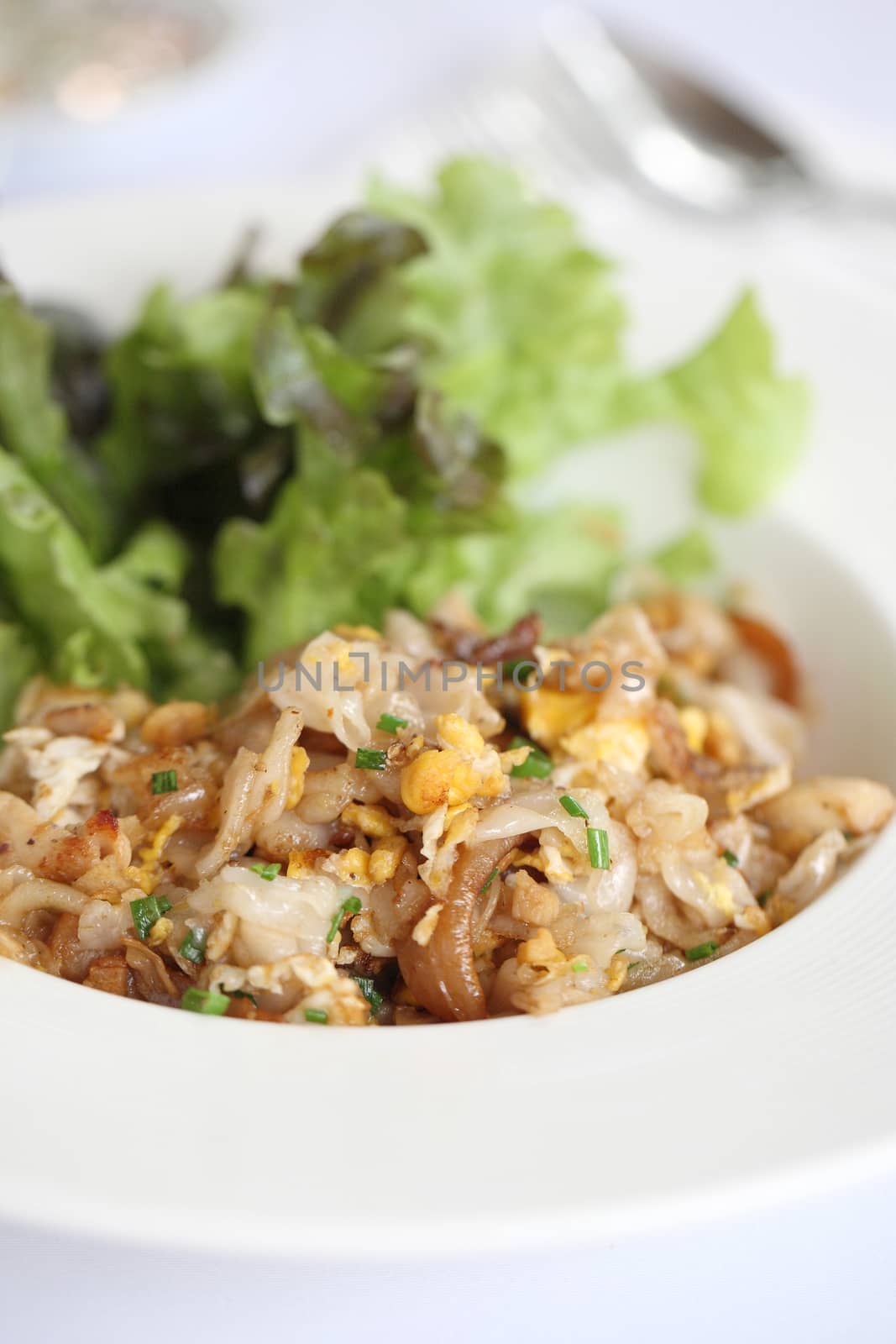 Thai food fried noodle with egg and pork 