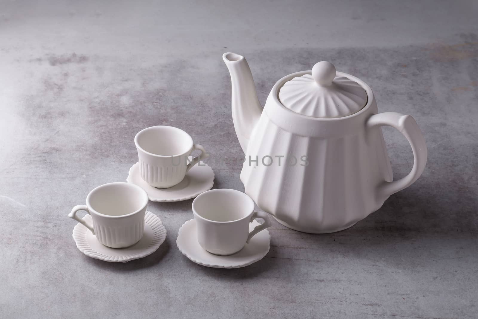 Teapot creamer, Cup and saucer on Cement Board by kaiskynet