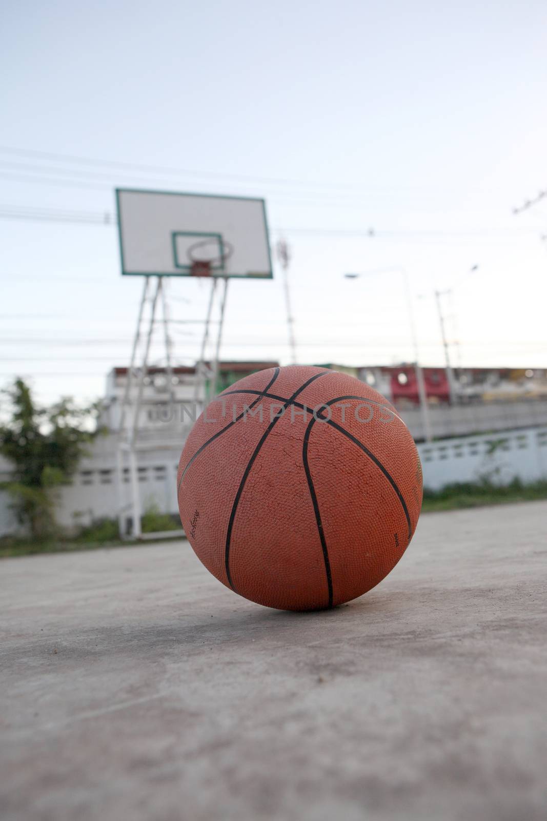 Basketball ball on street by piyato