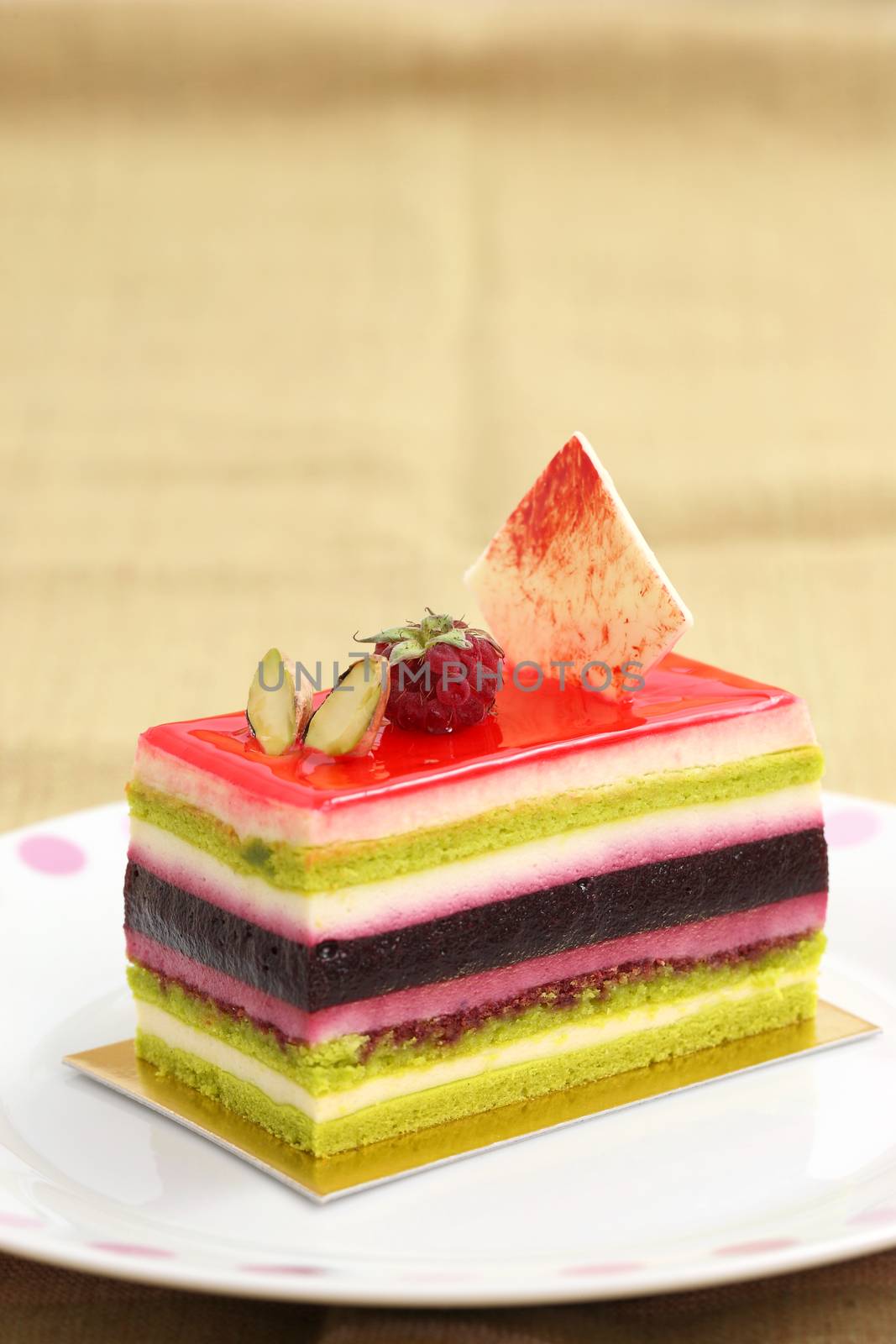 colorful fruit cake isolated in white background by piyato