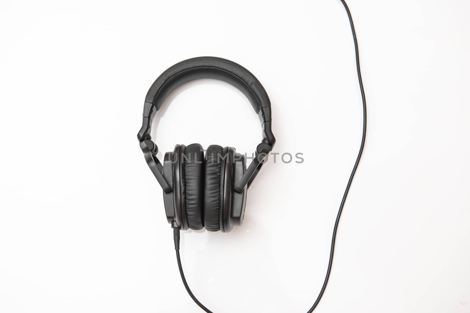 Black headphones on an isolated white background with copy space by marynkin