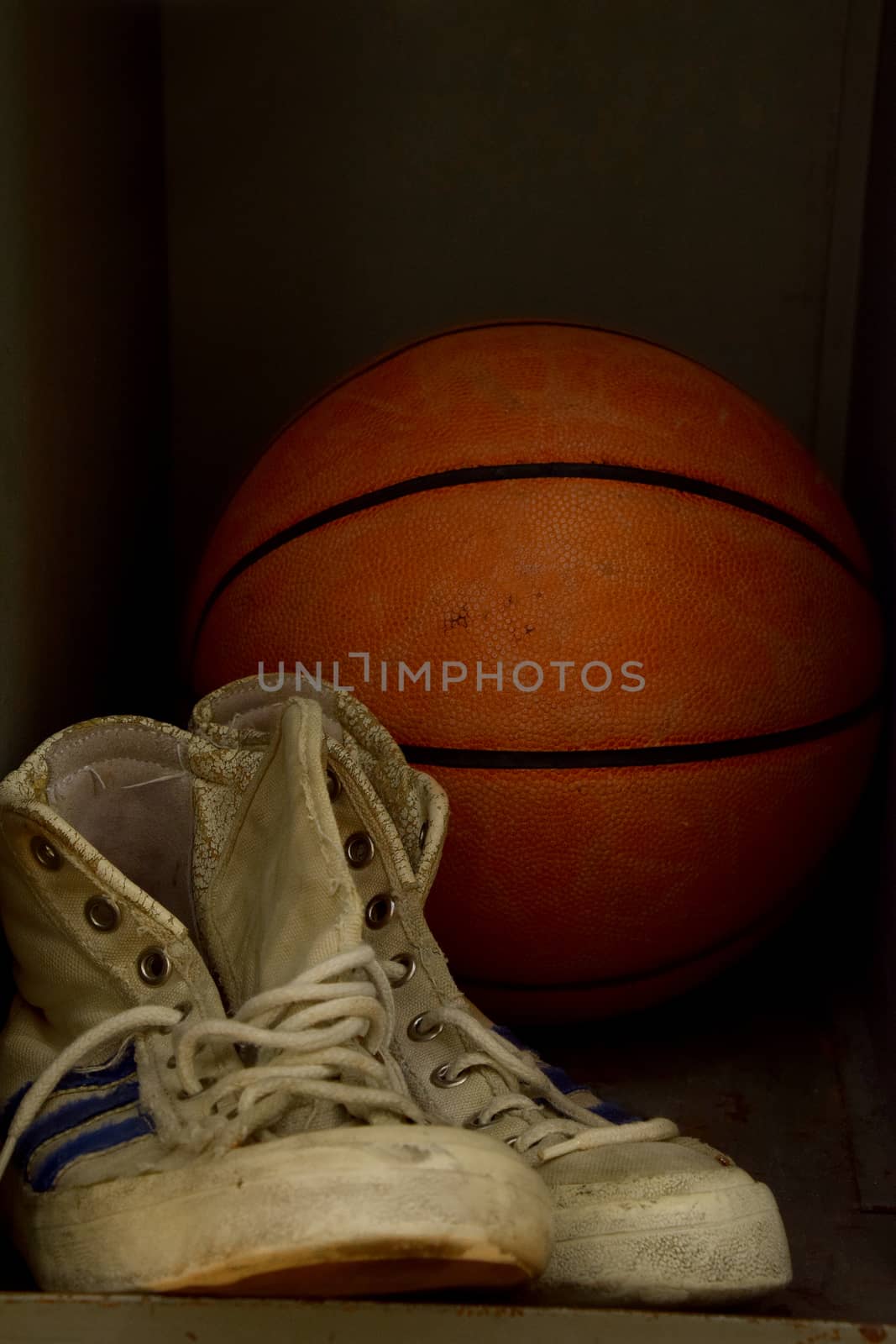 Old sport sneakers shoes and basketball ball by BreakingTheWalls