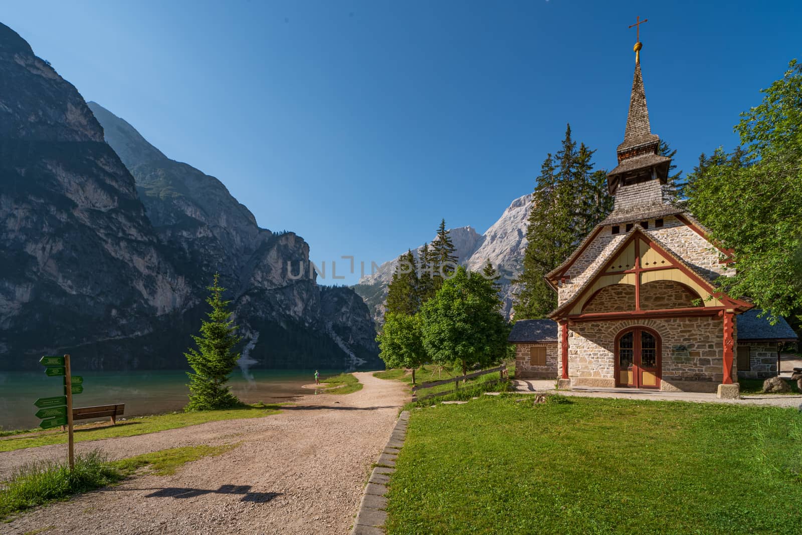 Small church surrounded by nature under the Seekofel mountains next to Lake Braies, Italian landscape in South Tyrol
