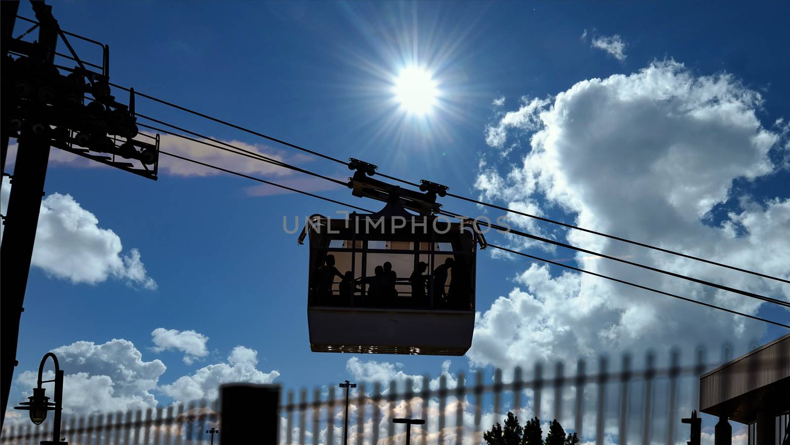 Cable Cars Crossing Montmorency Falls Under Sun by dbvirago
