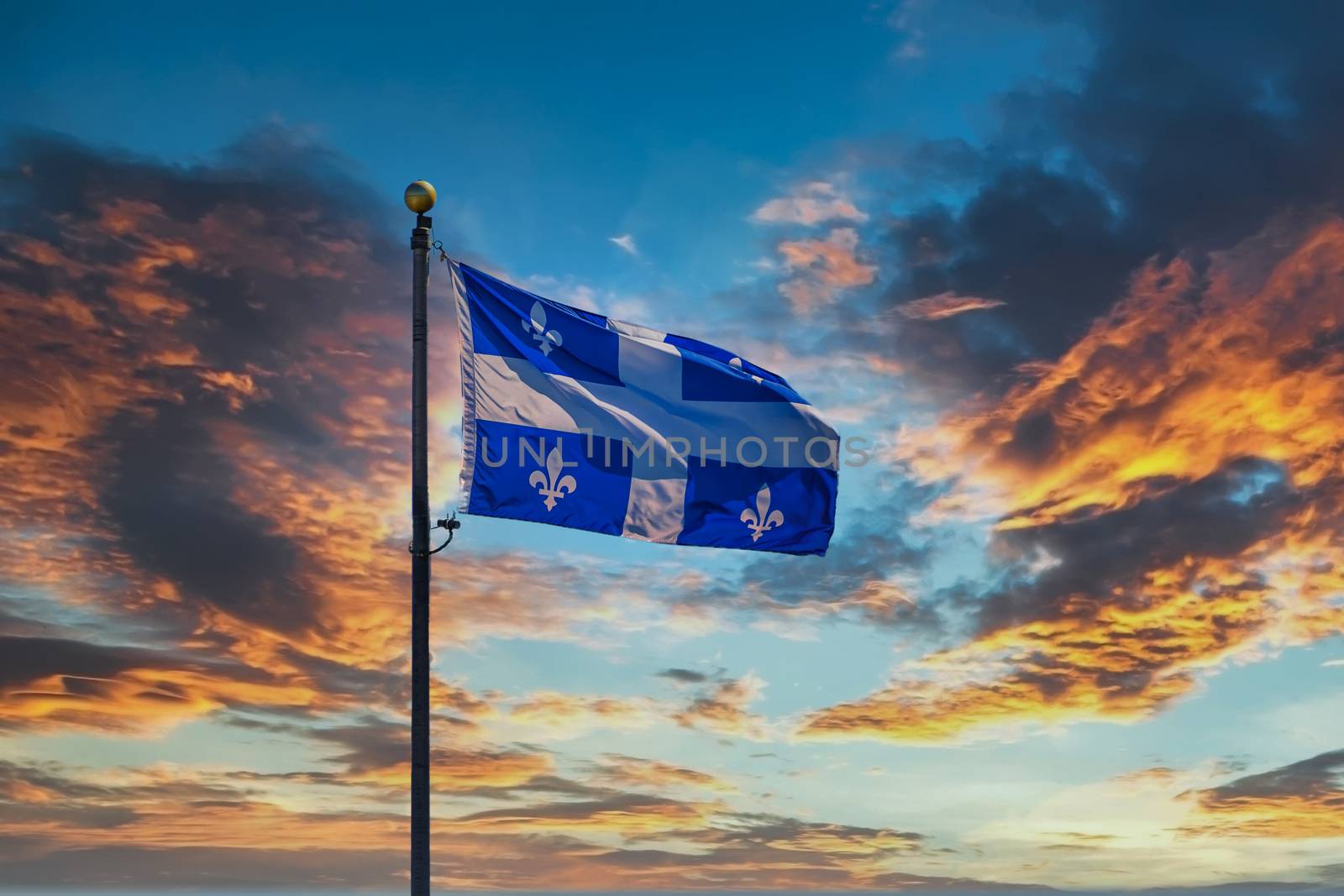 Quebec Flag on Sunset Sky by dbvirago