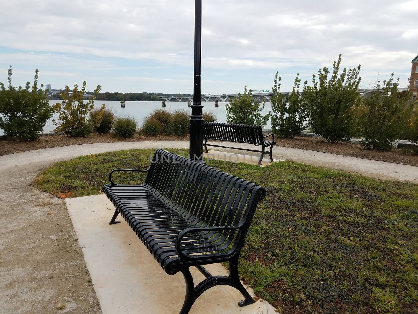 park benches and Wilson bridge in Alexandria, Virginia by stockphotofan1