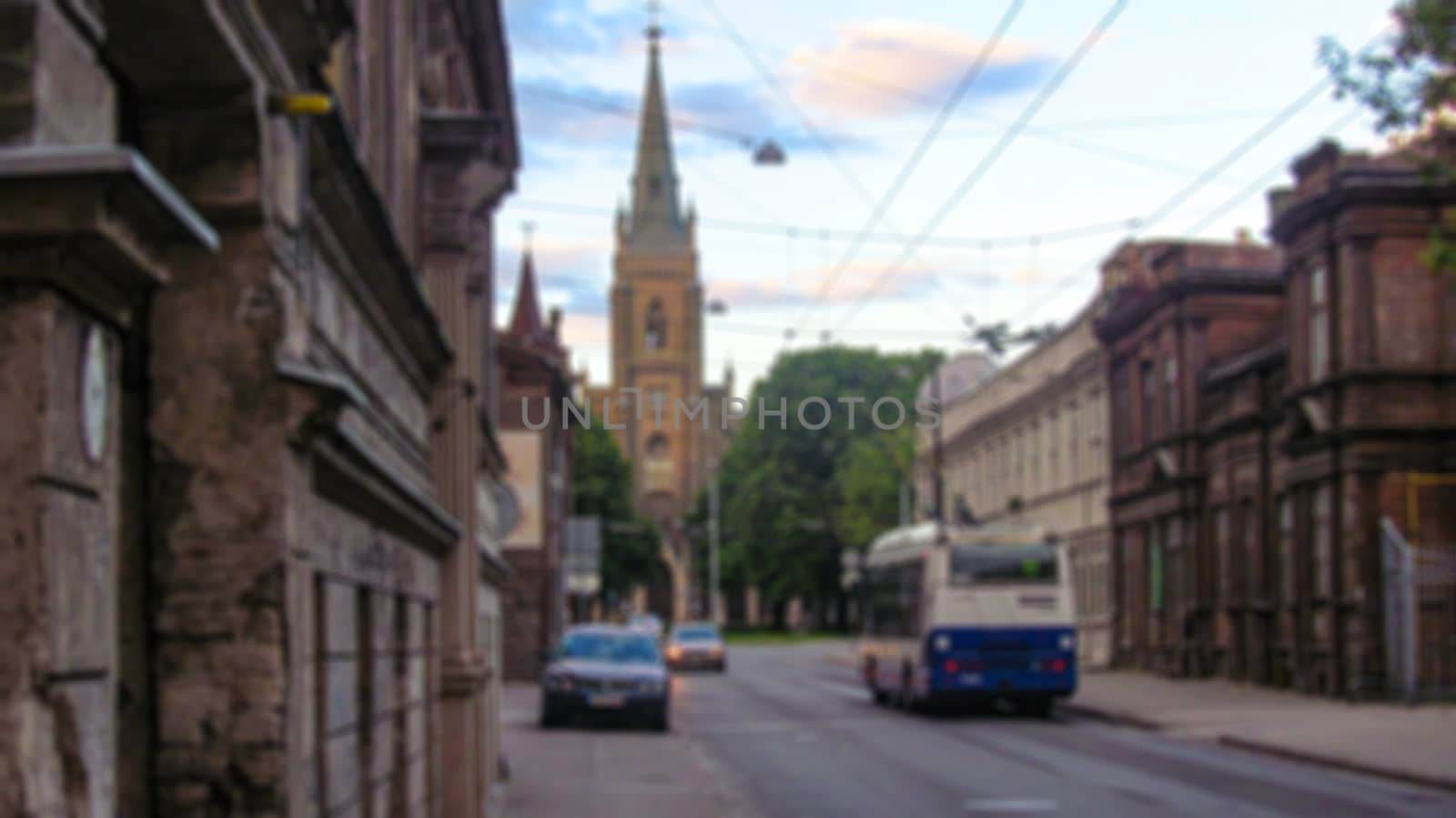 Blurred background of a city street. Urban landscape. Creative t by Grommik