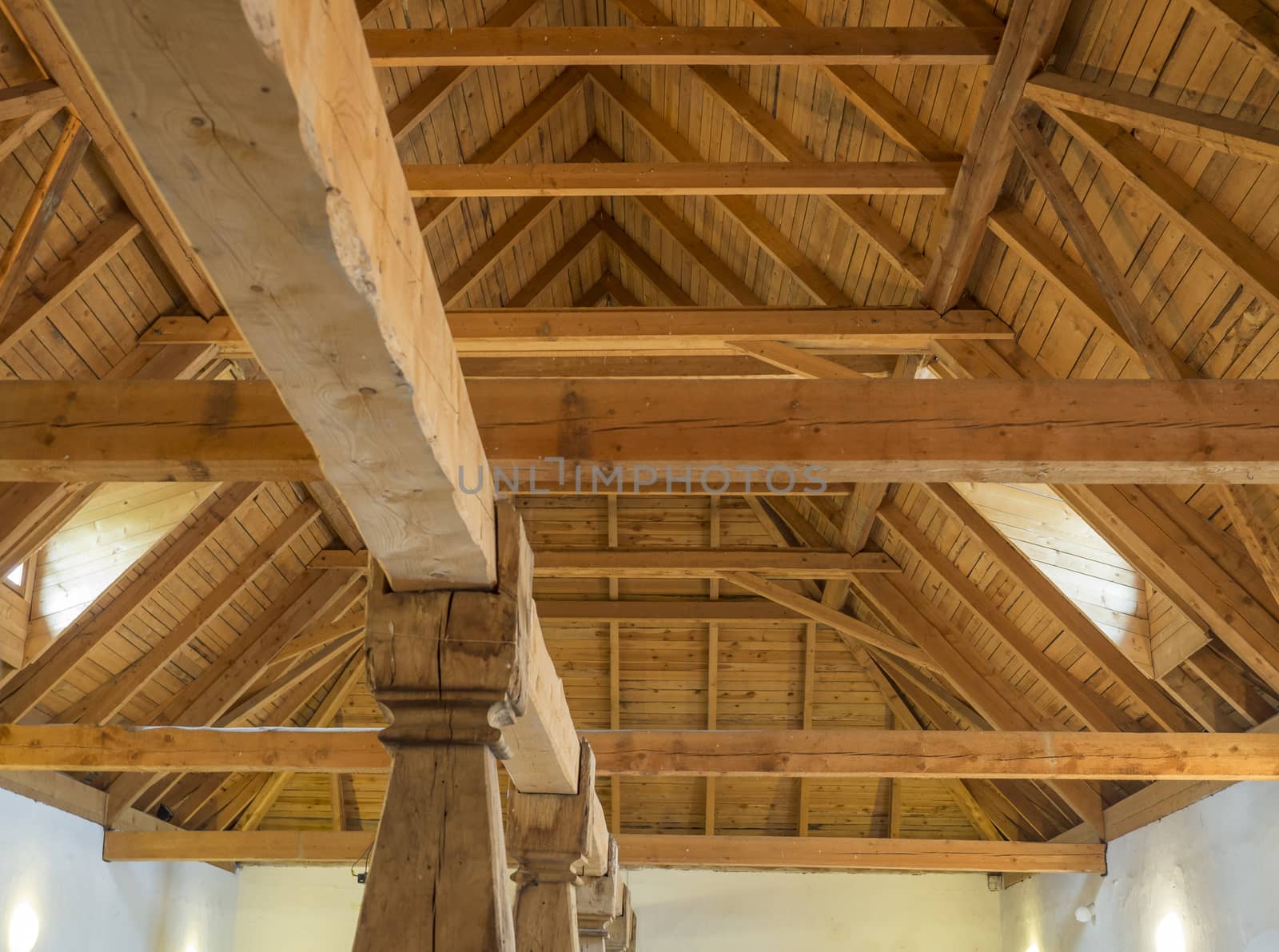 massive timber structure timberwork of roof on old baroque farm house made from natural oak wood