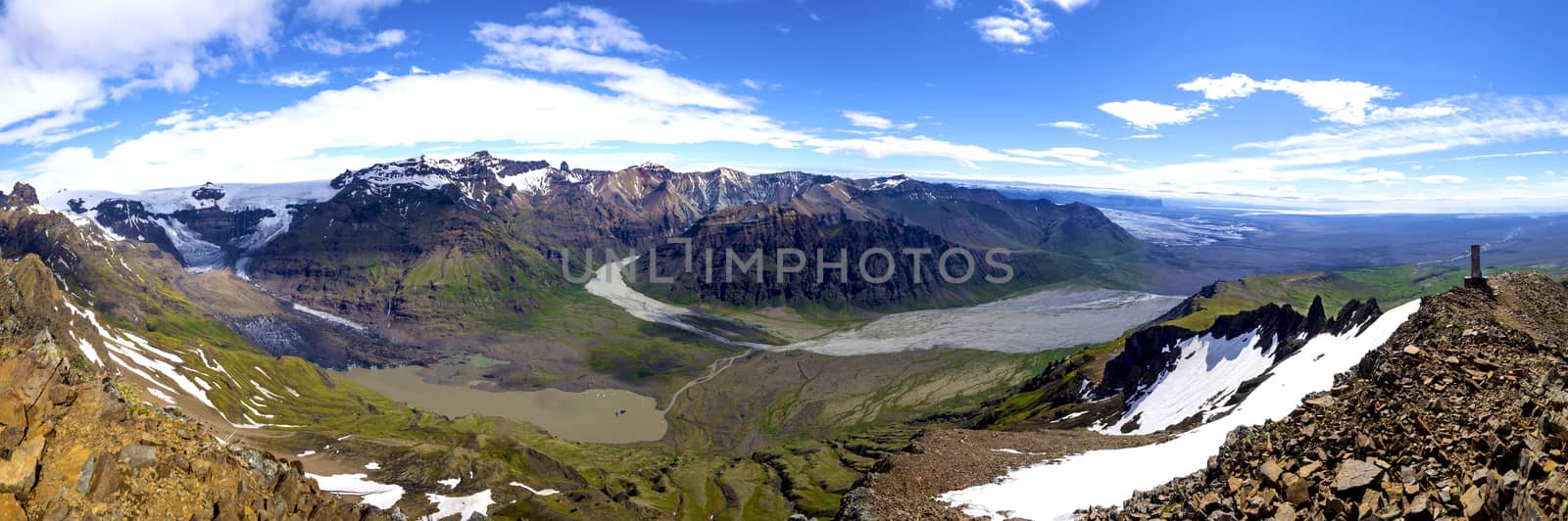 wide vivid landscape panorama, panoramic view from peak Kristinartindar, Skaftafell Park on valley Morsardalur, river delta, colorful rhyolit mountains, glacier tongues Skaftafellsjokull Vatnajokull spur.