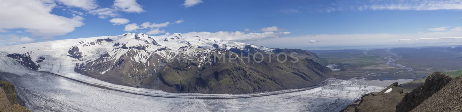 wide landscape panorama, panoramic view from peak Kristinartindar, Skaftafell Park on valley Morsardalur, river delta, colorful rhyolit mountains, glacier tongues Skaftafellsjokull Vatnajokull spur