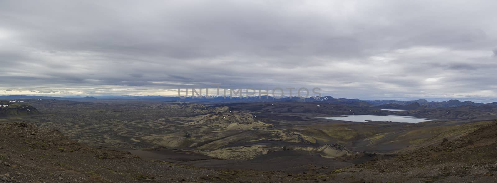 Colorful wide panorama, panoramic view on Volcanic landscape in Lakagigar, Laki Volcano crater chain with green lichens, moss and lakes Kambavatn and Lambavatn, Iceland, moody sky background by Henkeova