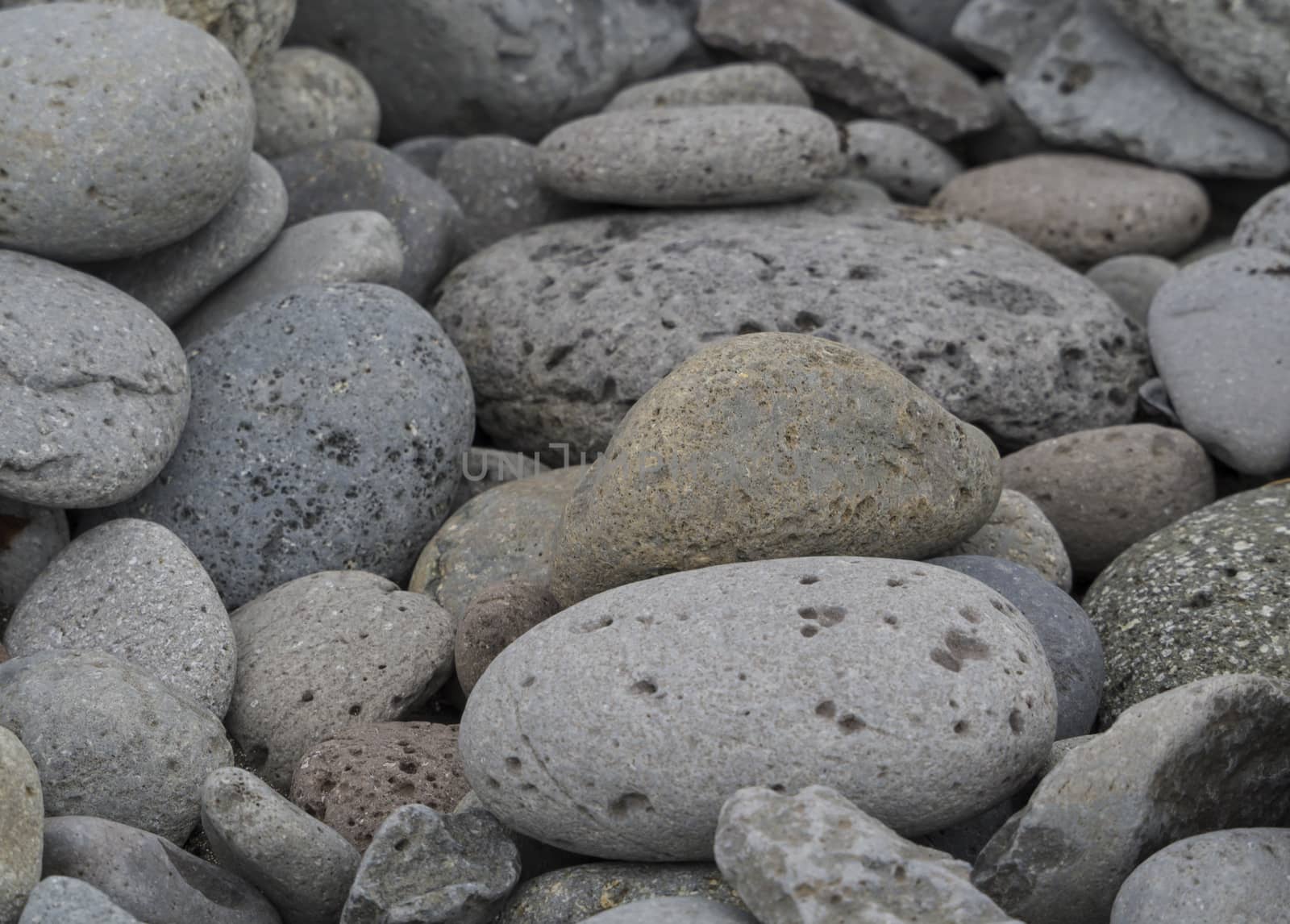 Gray and color stone background, pebble stones texture by Henkeova