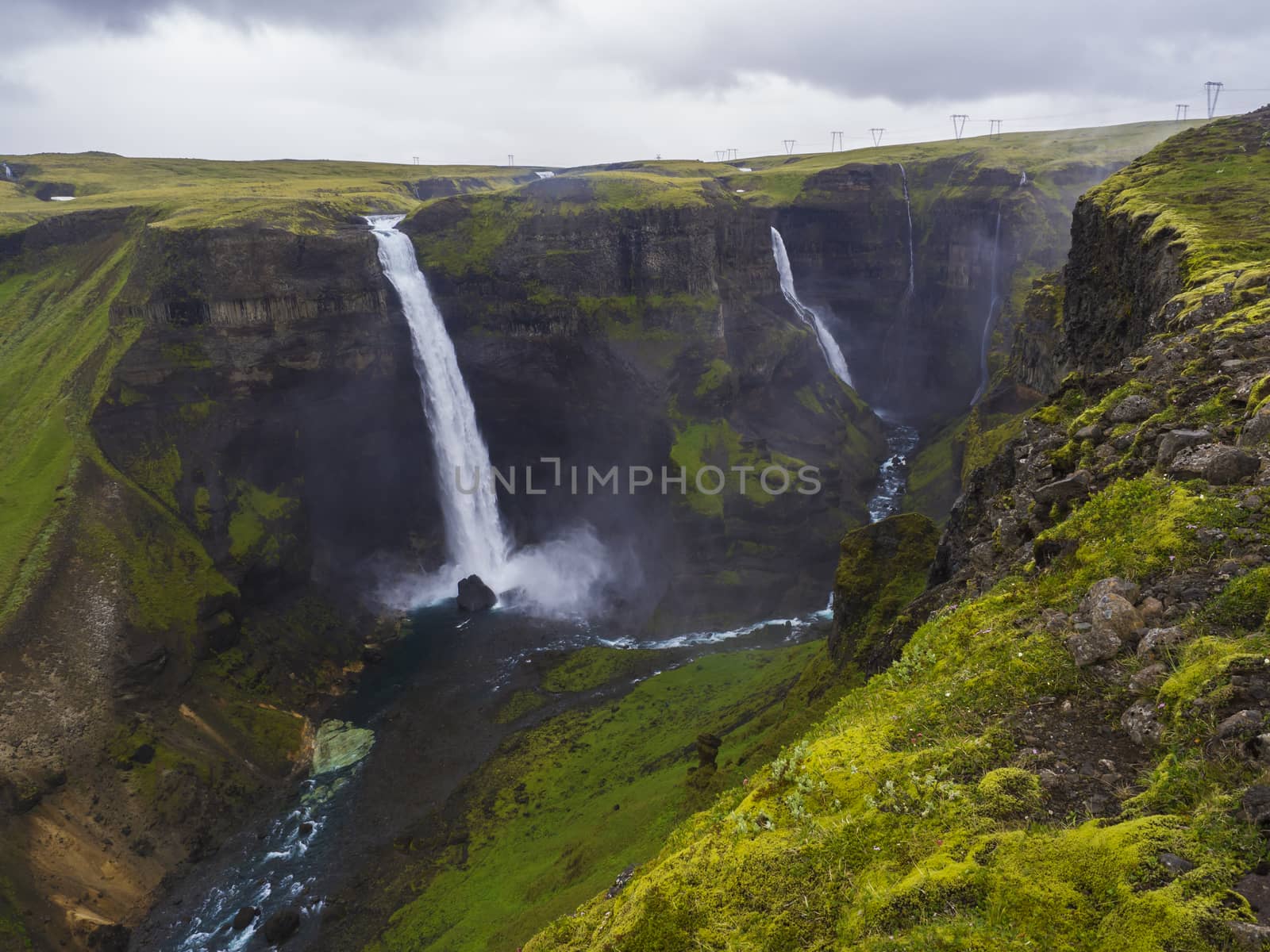 Valley of river Fossa with Beautiful Haifoss waterfall in South Iceland, summer moody sky.