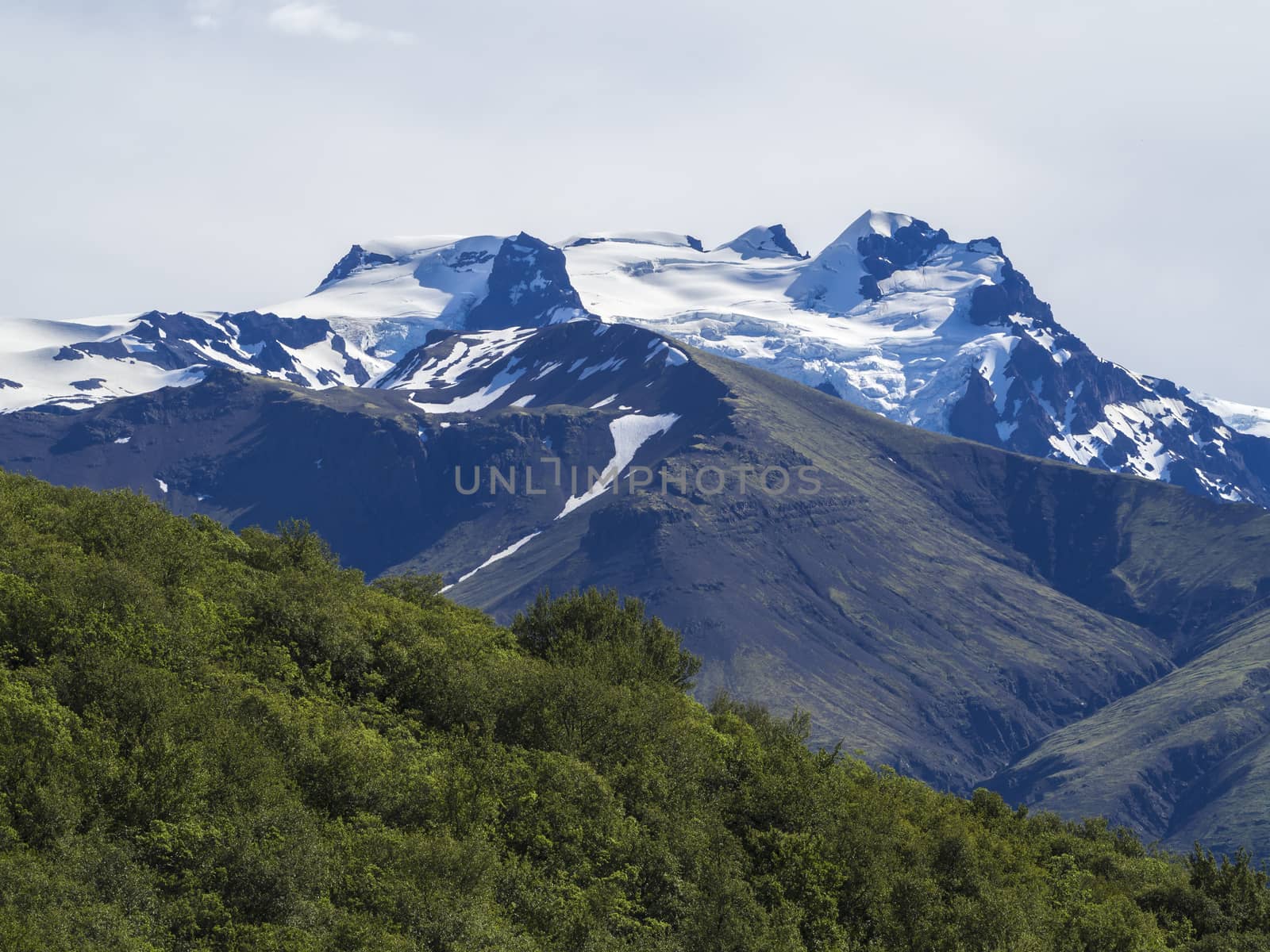View on top of Hvannadalshnukur peak, highest iceland mountain and green bush, in Vatnajokull National Park
