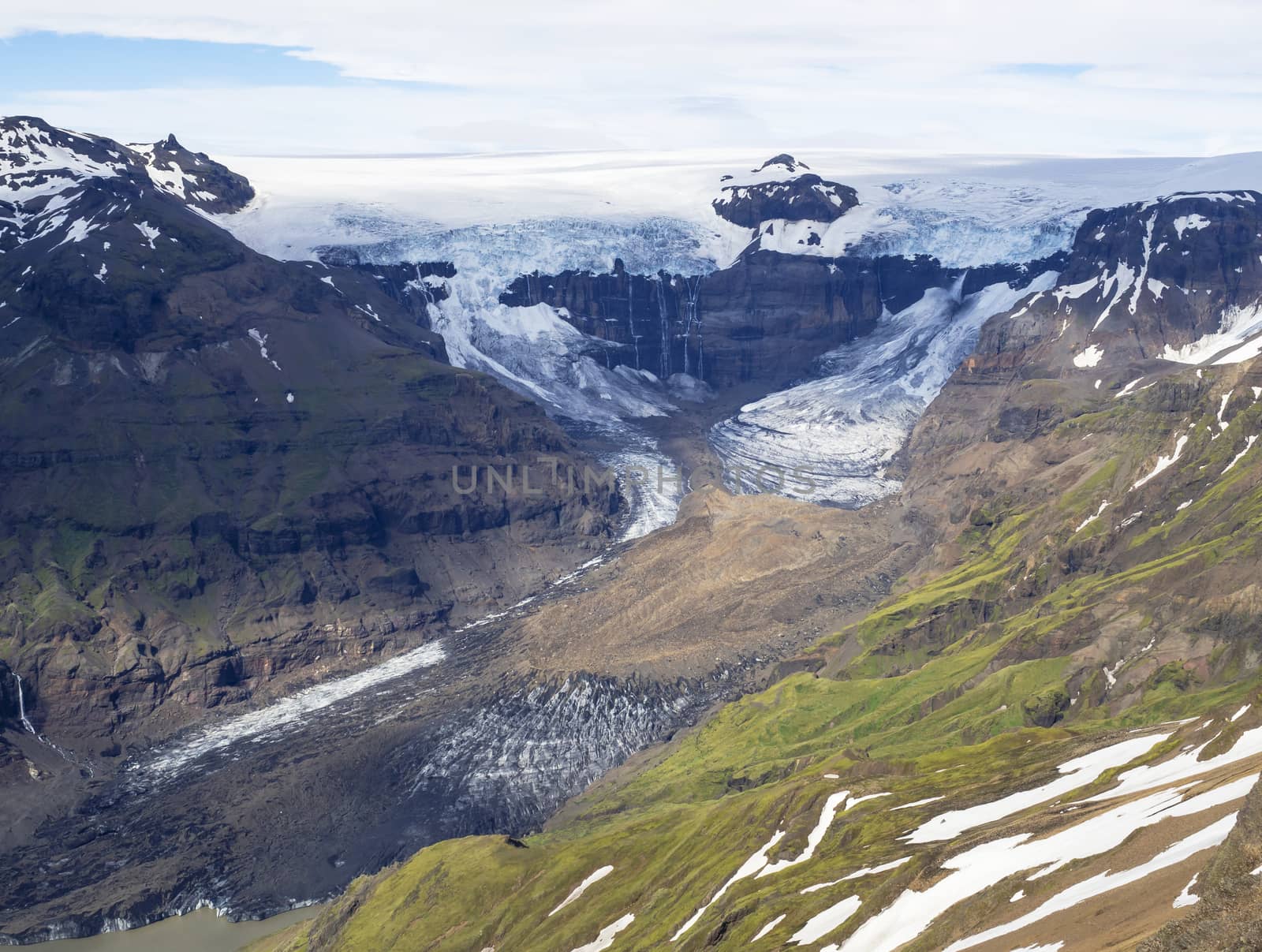 view from peak Kristinartindar with glacier tongues Skaftafellsjokull, waterfalls, colorful rhyolit mountains,Vatnajokull spur in Skaftafell Park, South Iceland by Henkeova