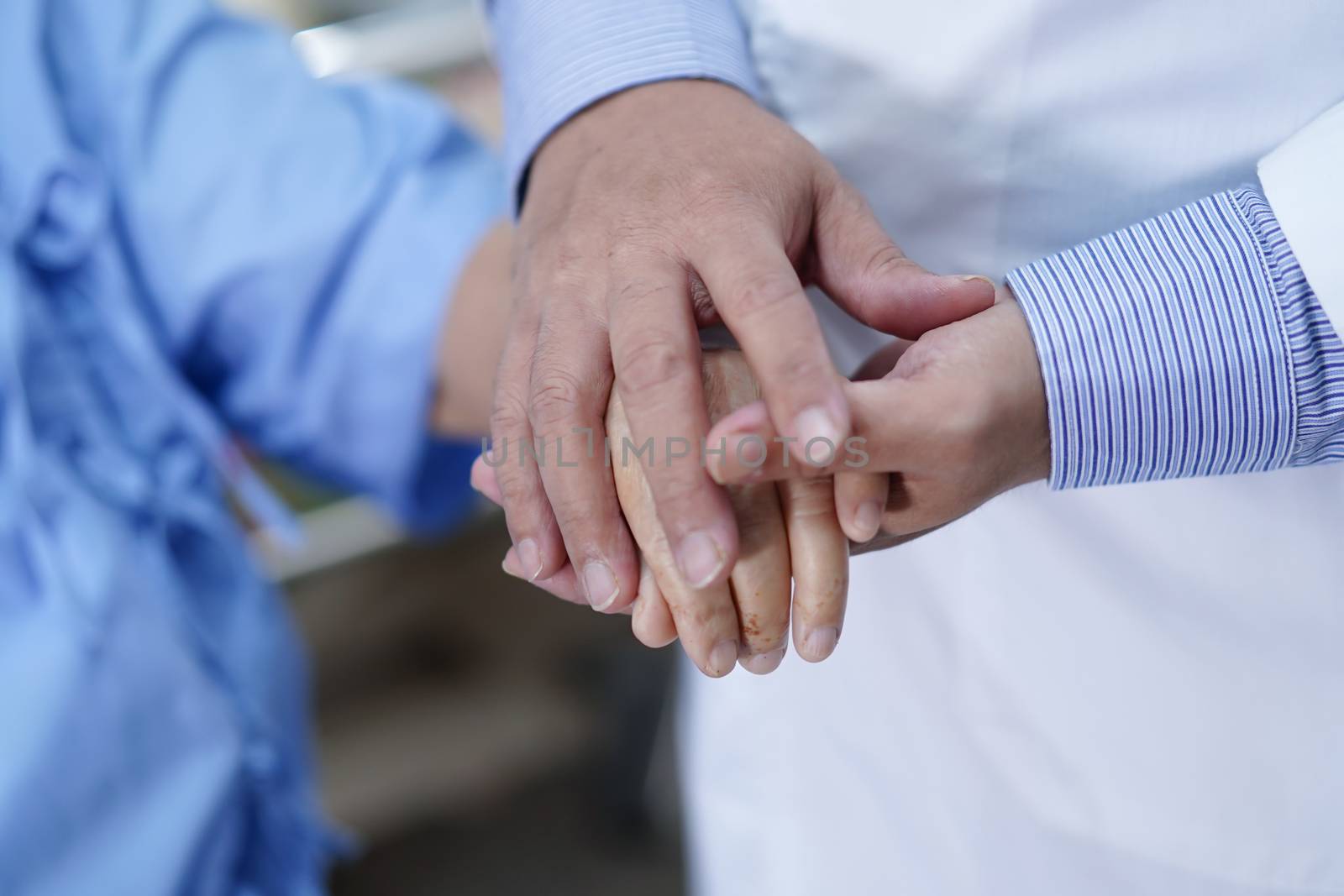 Holding Touching hands Asian senior or elderly old lady woman patient with love, care, helping, encourage and empathy at nursing hospital ward : healthy strong medical concept