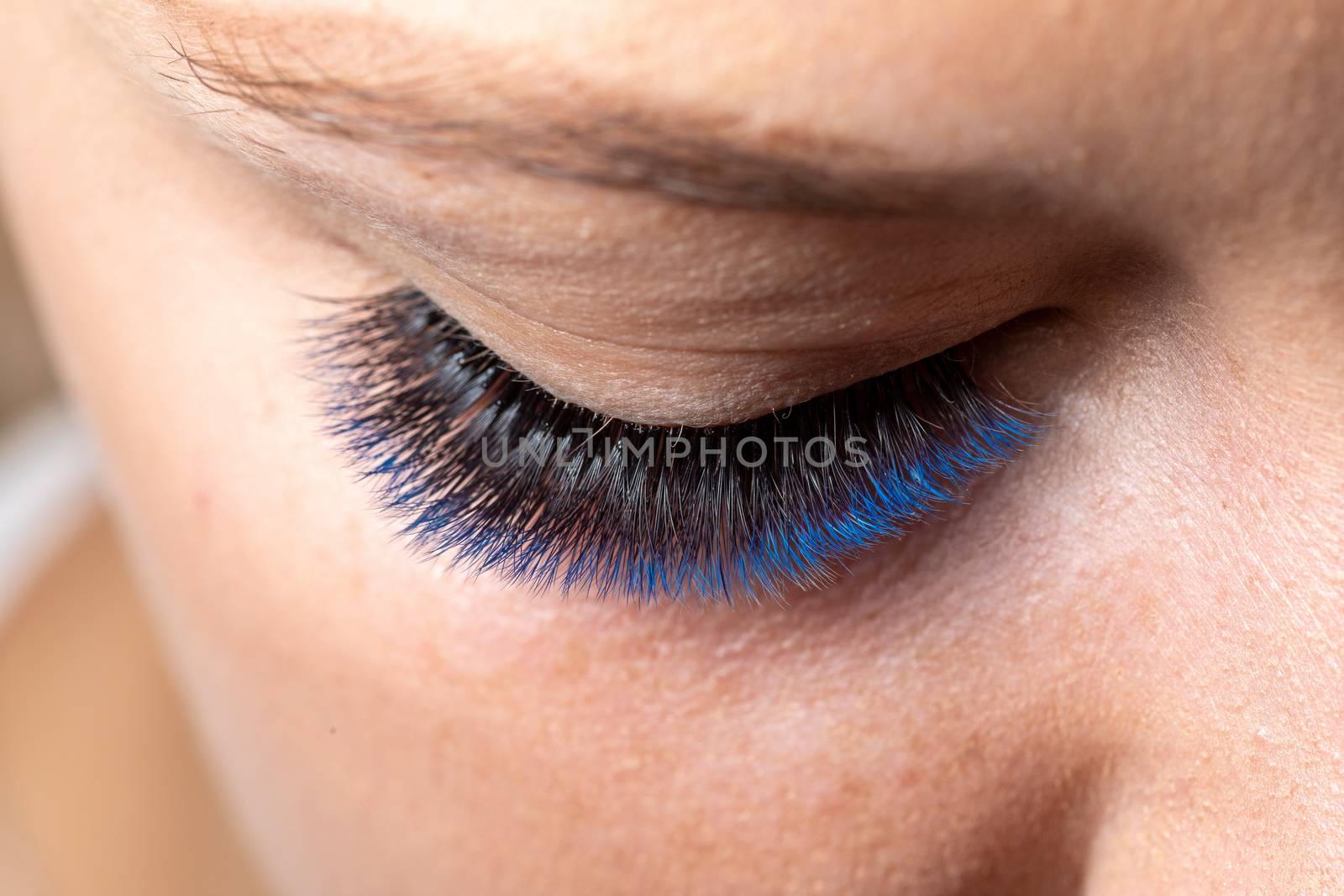 Blue Eyelash Extension with diferent colors. Lashes. Woman Eyes with Long Eyelashes in diferent color.