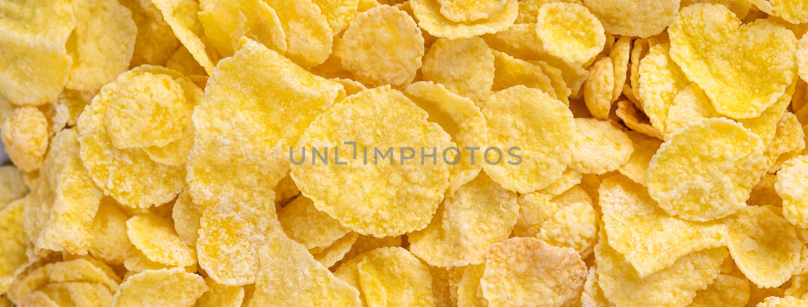 Corn flakes bowl sweets on gray cement background, top view flat by ROMIXIMAGE