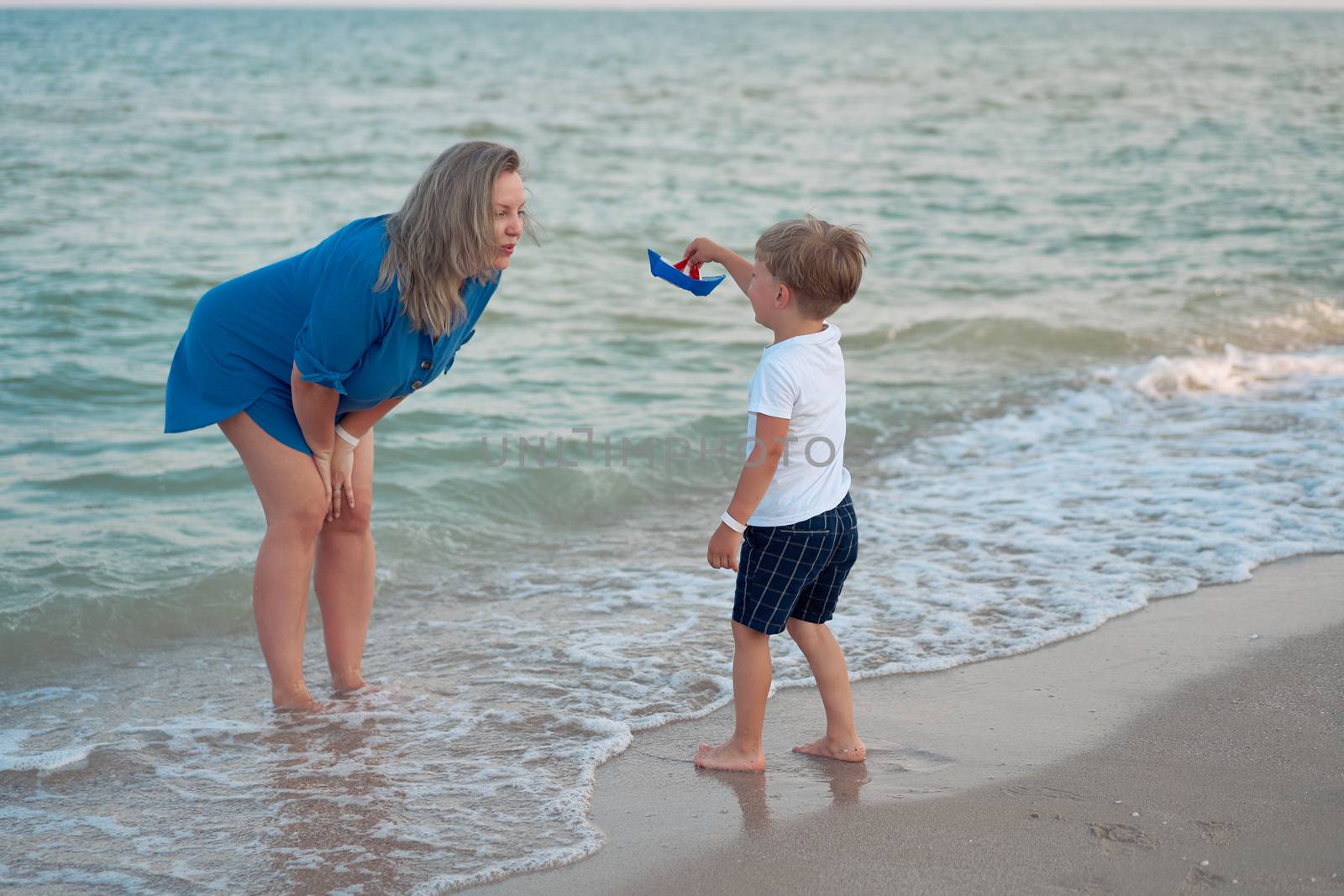 Mother son spending time together sea vacation Young dad child little boy walking beach Mother day. Family with one child. Happy childhood with mommy. Walking ocean wave