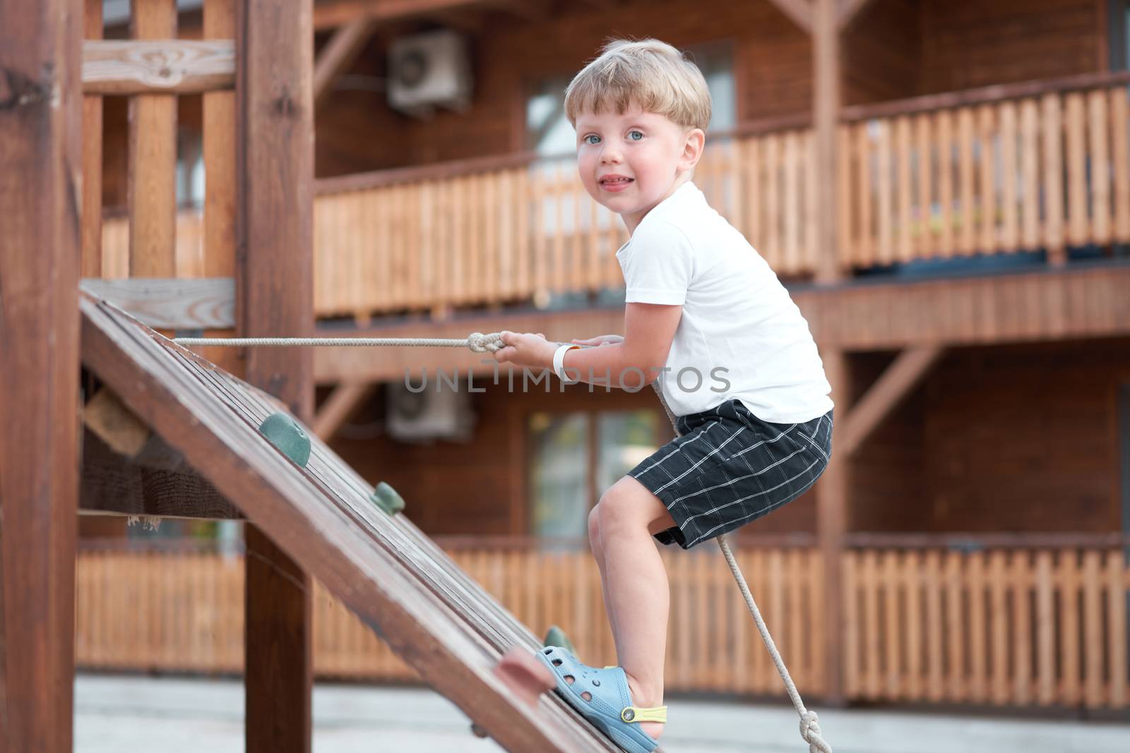 Boy play playground Child climbing rope outdoor Children healthy summer activity Healthy growth