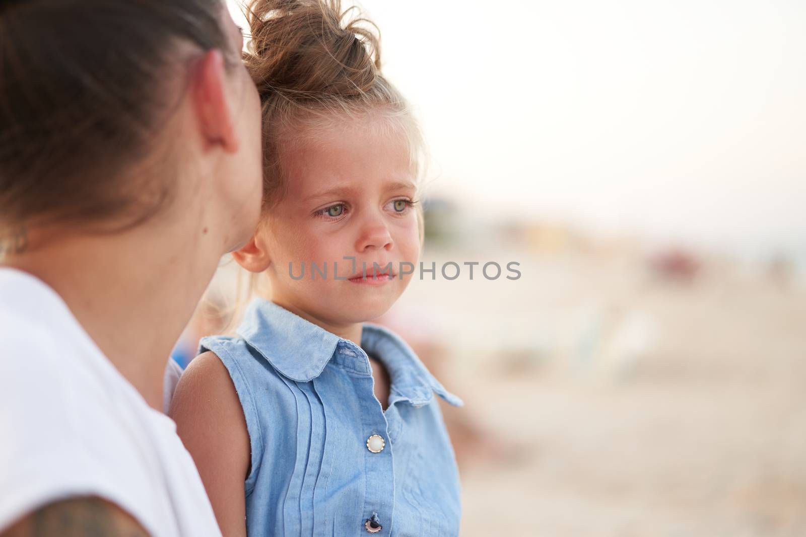 Little girl crying Mother daughter summer beach. Child upset and cry Adorable caucasian kid cry Childhood problems