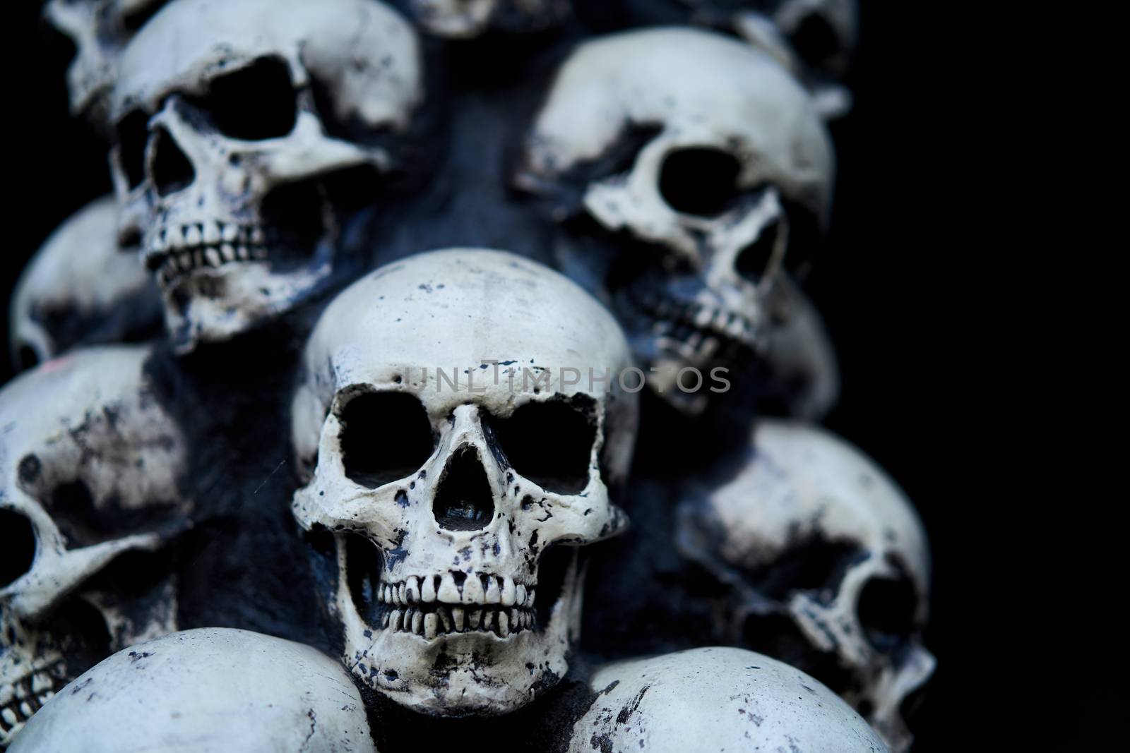 Skull Halloween background Many people skulls stand on top of each other. Mystic creepy concept. Abstract nightmare occult memorial