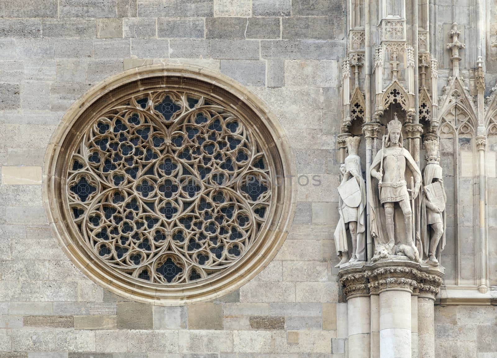 Round gothic window on the facade of the St. Stephen's cathedral, Vienna by Goodday