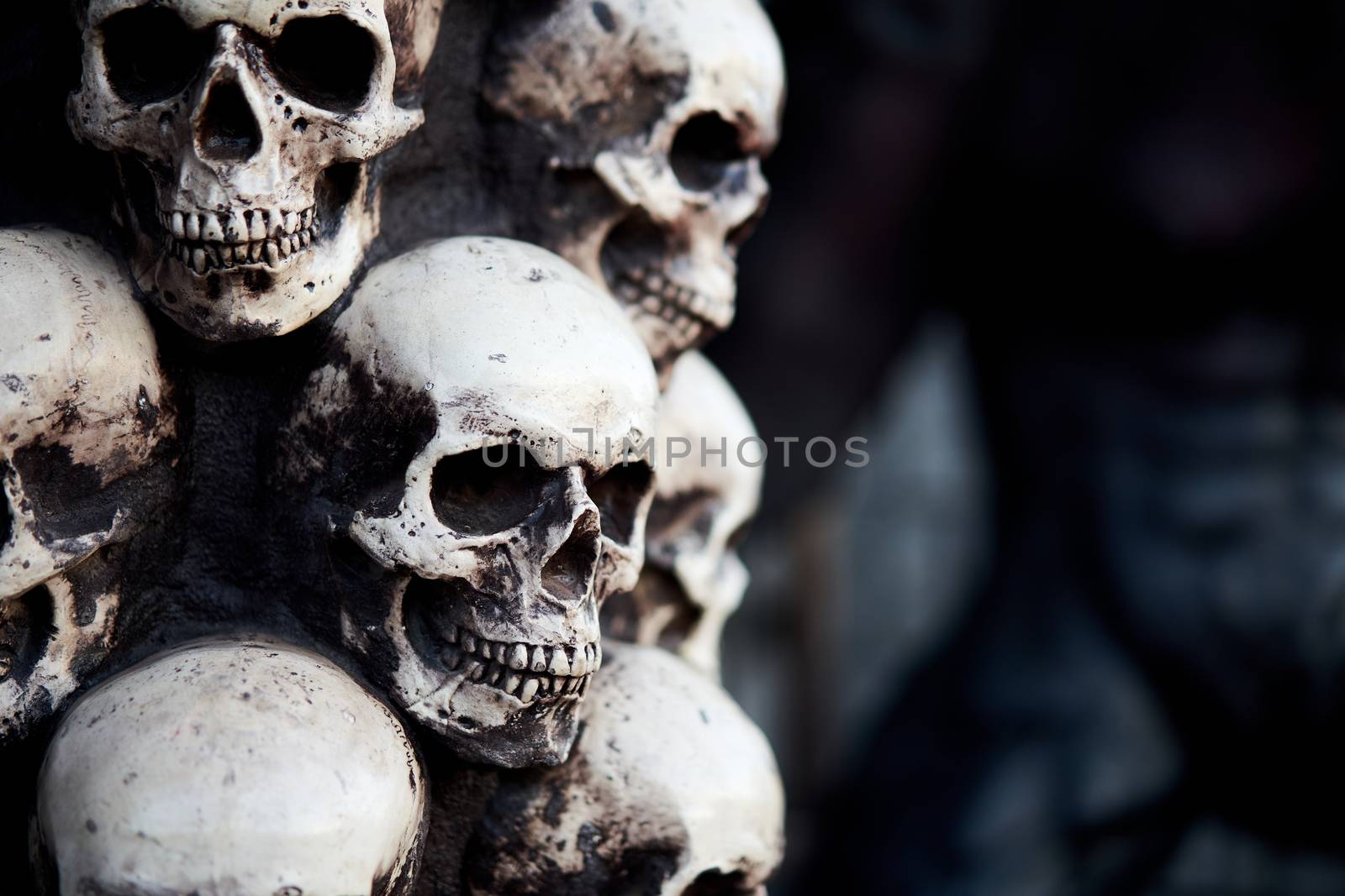 Skull Halloween background Many people skulls stand on top of each other. Mystic creepy concept. Abstract nightmare occult memorial