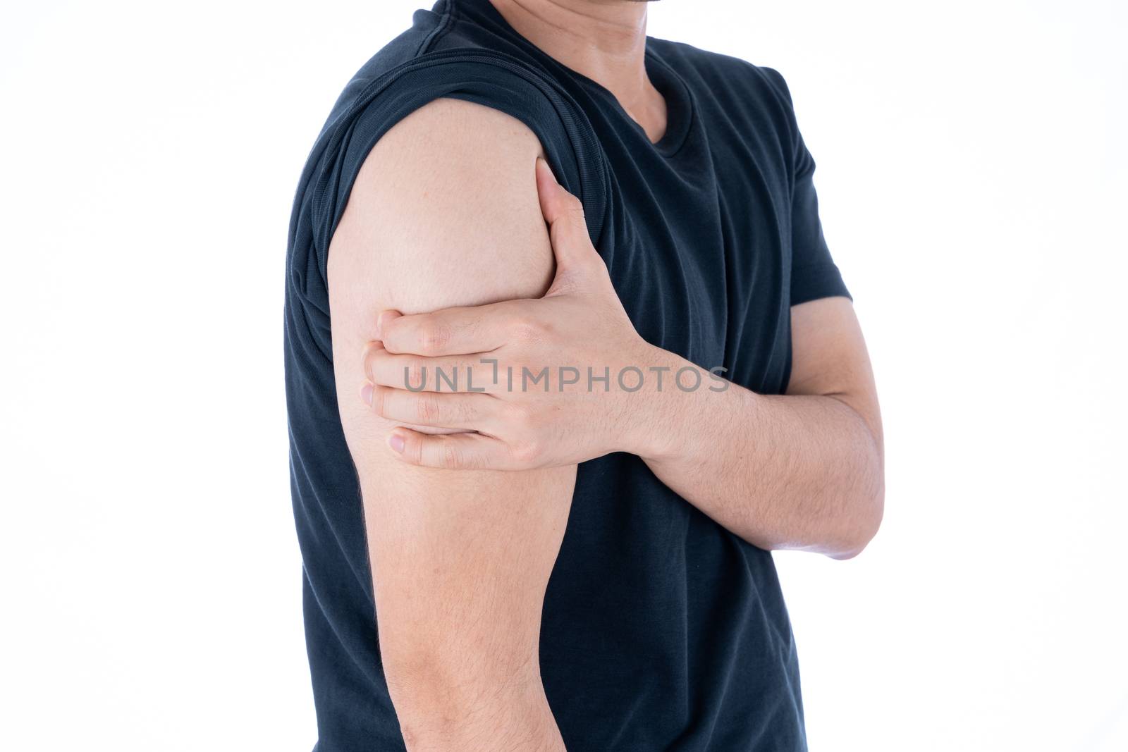 A man feeling exhausted and suffering from arm pain and injury on isolated white background. Health care and medical concept.