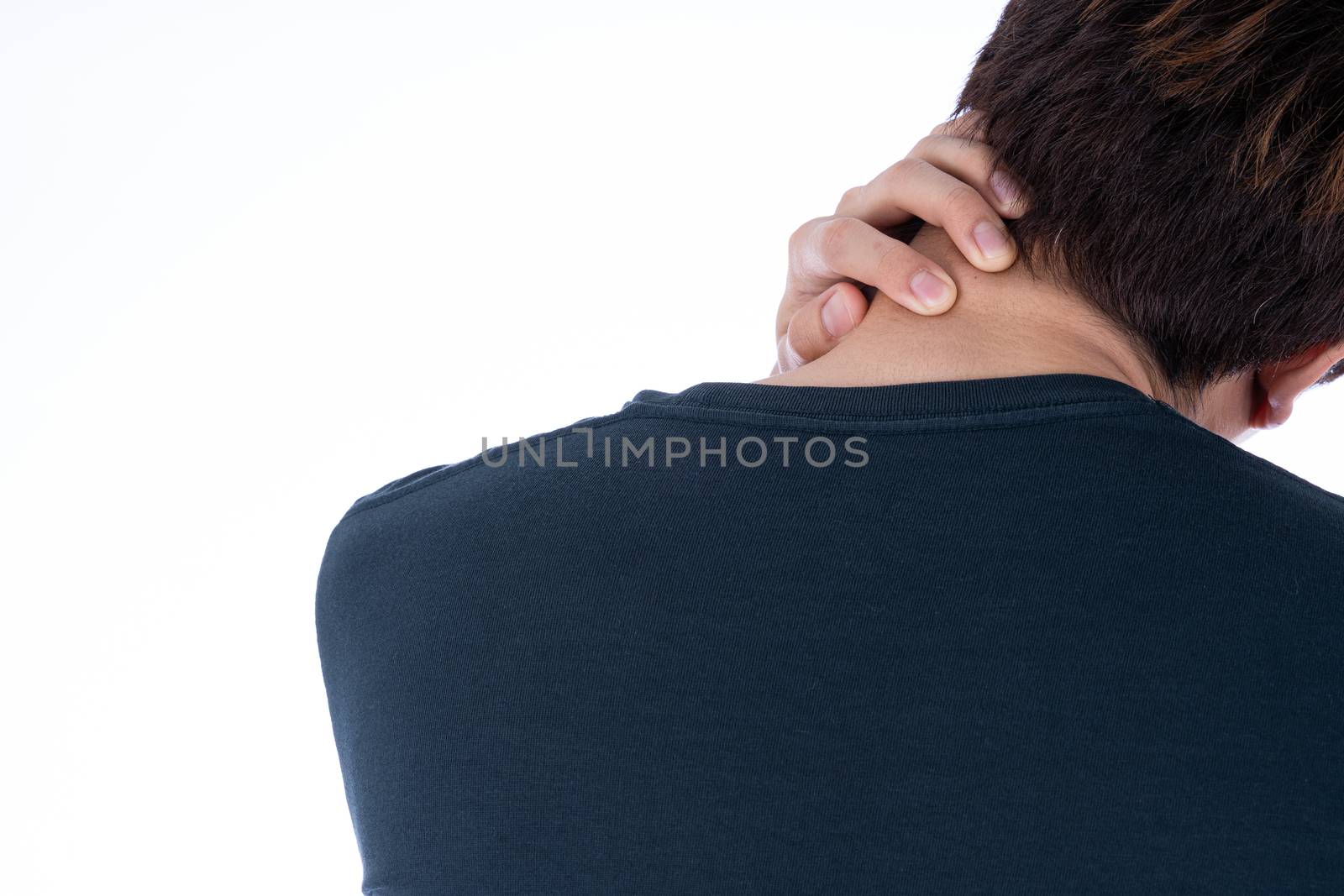 A man feeling exhausted and suffering from shoulder and neck pain and injury on isolated white background. Health care and medical concept.
