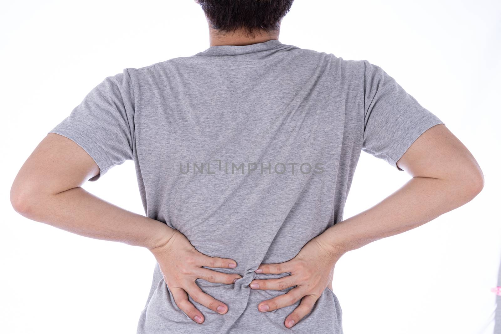 A man feeling exhausted and suffering from waist and back pain and injury on isolated white background. Health care and medical concept.