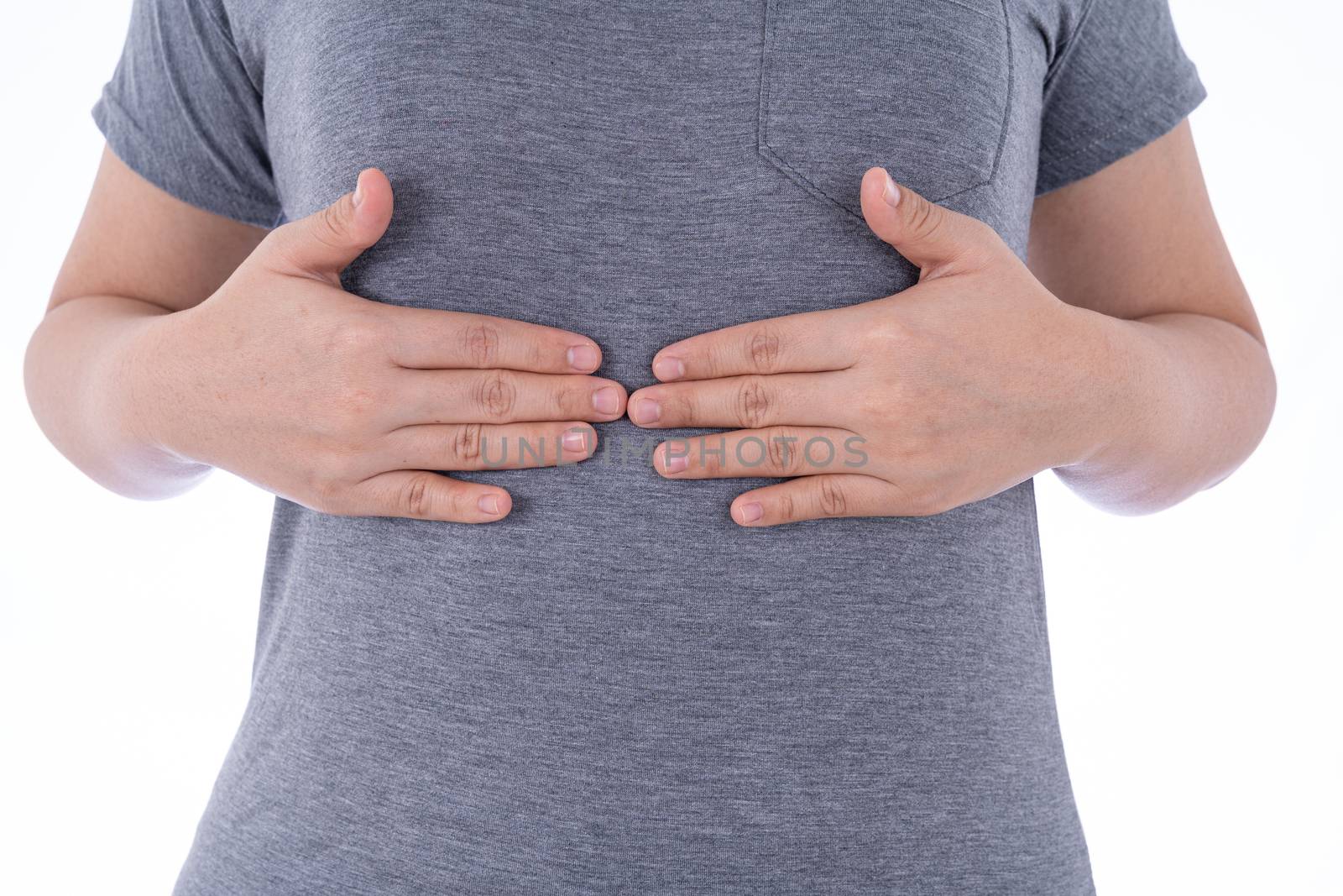 A woman feeling exhausted and suffering from stomach pain and injury on isolated white background. Health care and medical concept.