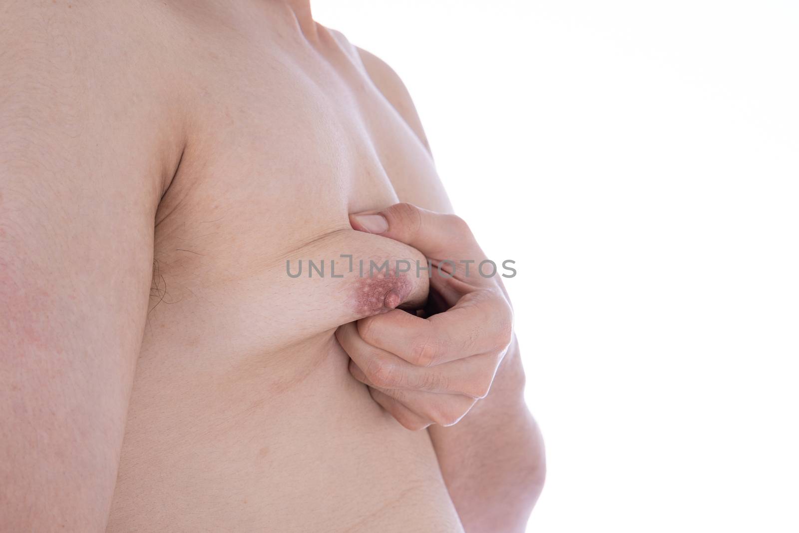 Close up man holding men boobs on white background. Diet, weight loss, slim body, healthy lifestyle concept.