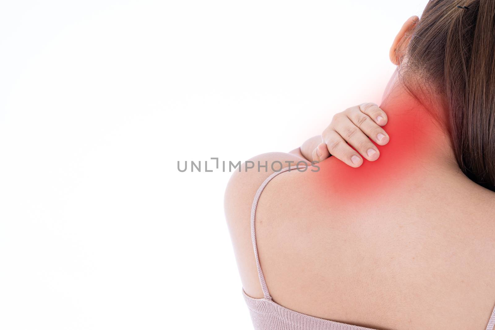 A woman feeling exhausted and suffering from shoulder and neck pain and injury on isolated white background with red spot. Health care and medical concept.