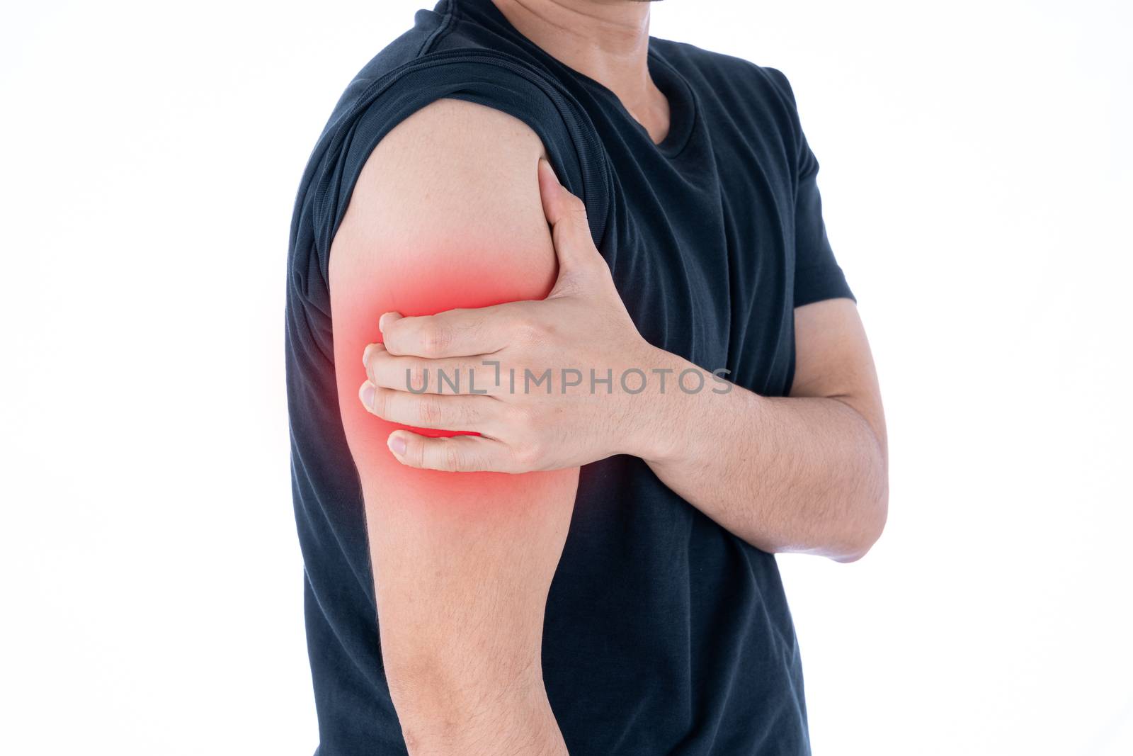 A man feeling exhausted and suffering from arm pain and injury on isolated white background with red spot. Health care and medical concept.